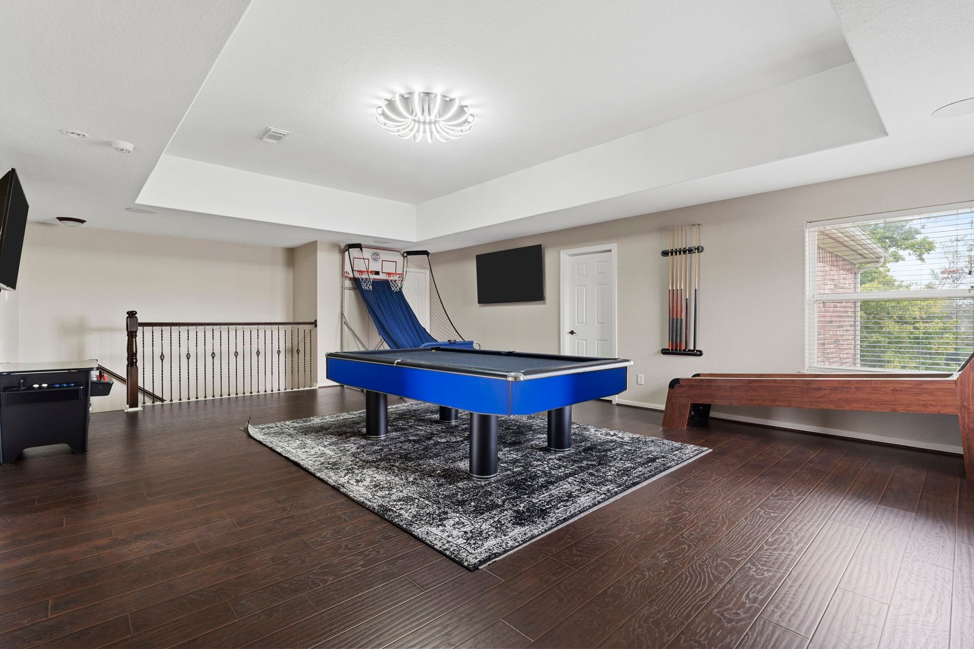 4502 Creek Point Lane, Missouri City, TX 77459 Fun and functional game room offering a versatile space for entertainment, recreation, and quality time with family and friends.