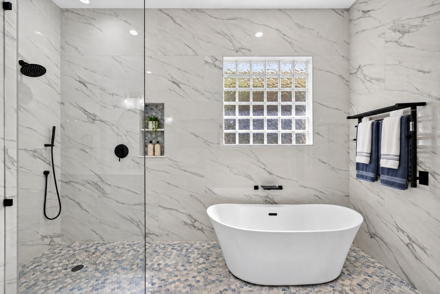 821 W 17th Street, #B, Houston, TX 77008 Spa-inspired wet room features a freestanding soaking tub, oversized walk-in shower, designer tile, and sleek matte-black fixtures.