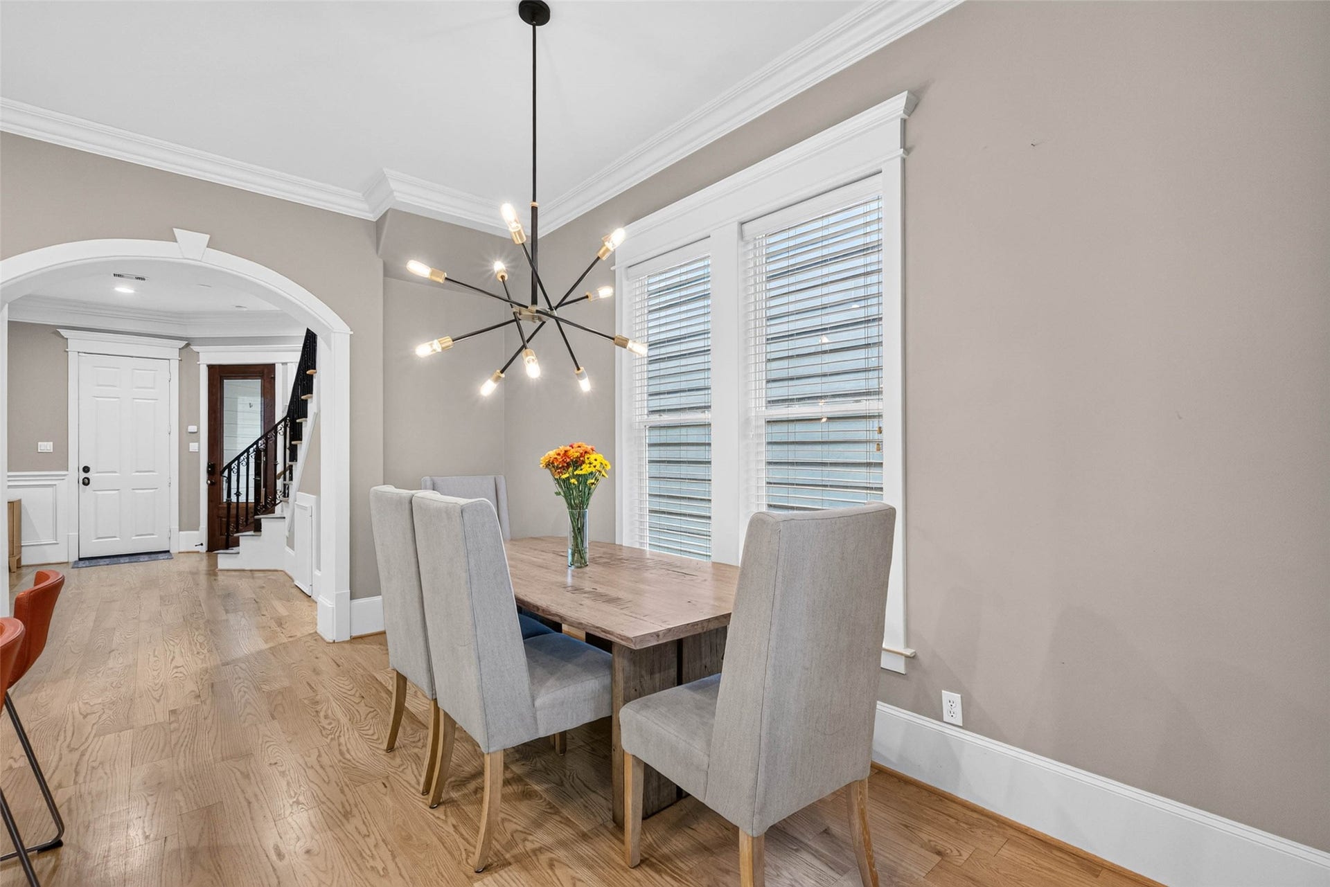 821 W 17th Street, #B, Houston, TX 77008 Sunlight, hardwood floors and statement lighting give this intimate dining space a warmth all its own.