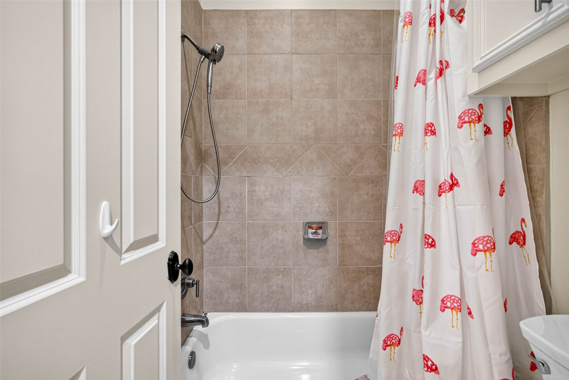 821 W 17th Street, #B, Houston, TX 77008 You'll find the tub/shower combination and toilet through the door to the left of the vanity