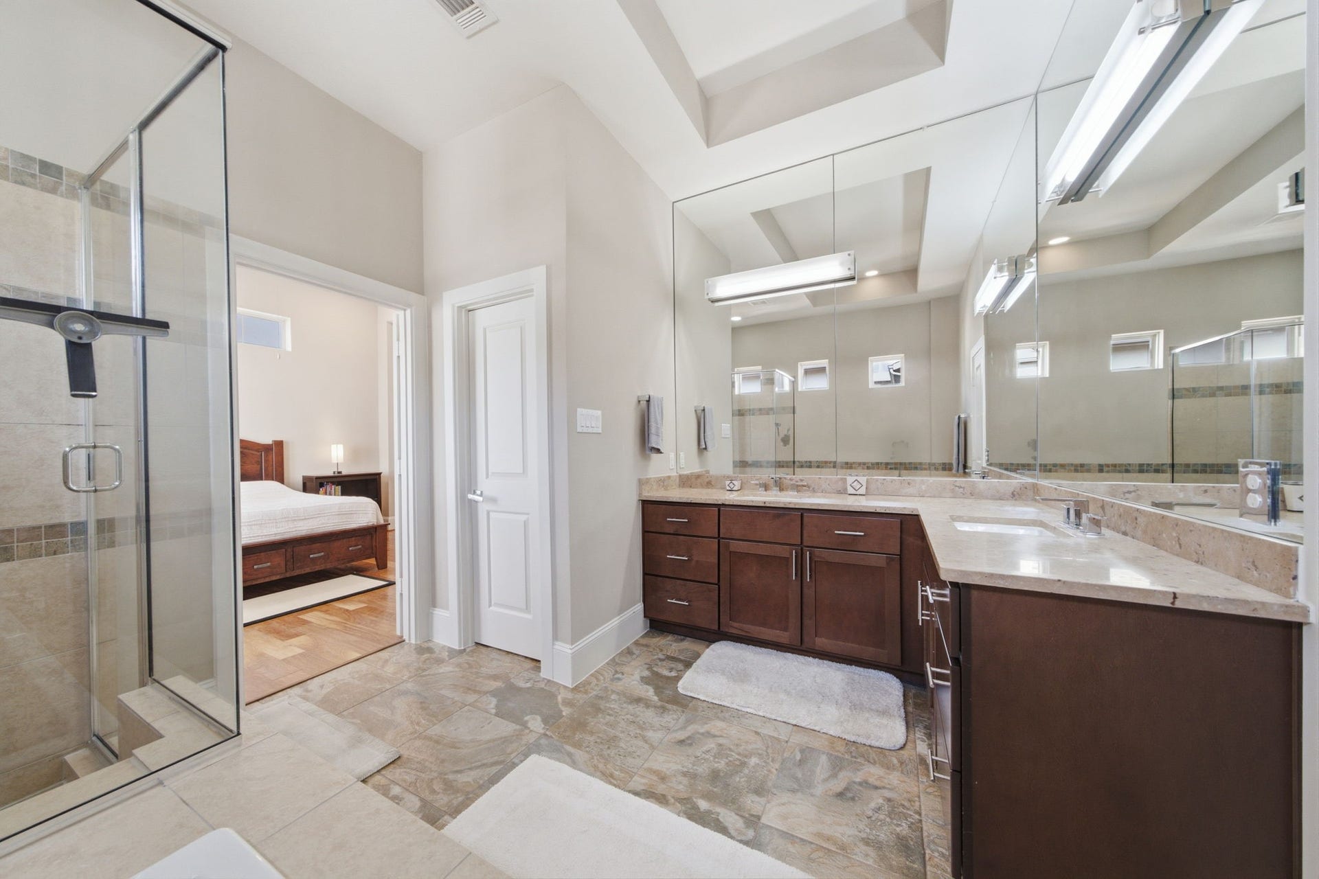 5531 Venice Street, Houston, TX 77007 An L-shaped dual vanity provides generous countertop space, making busy mornings feel effortless while offering abundant cabinet storage below.