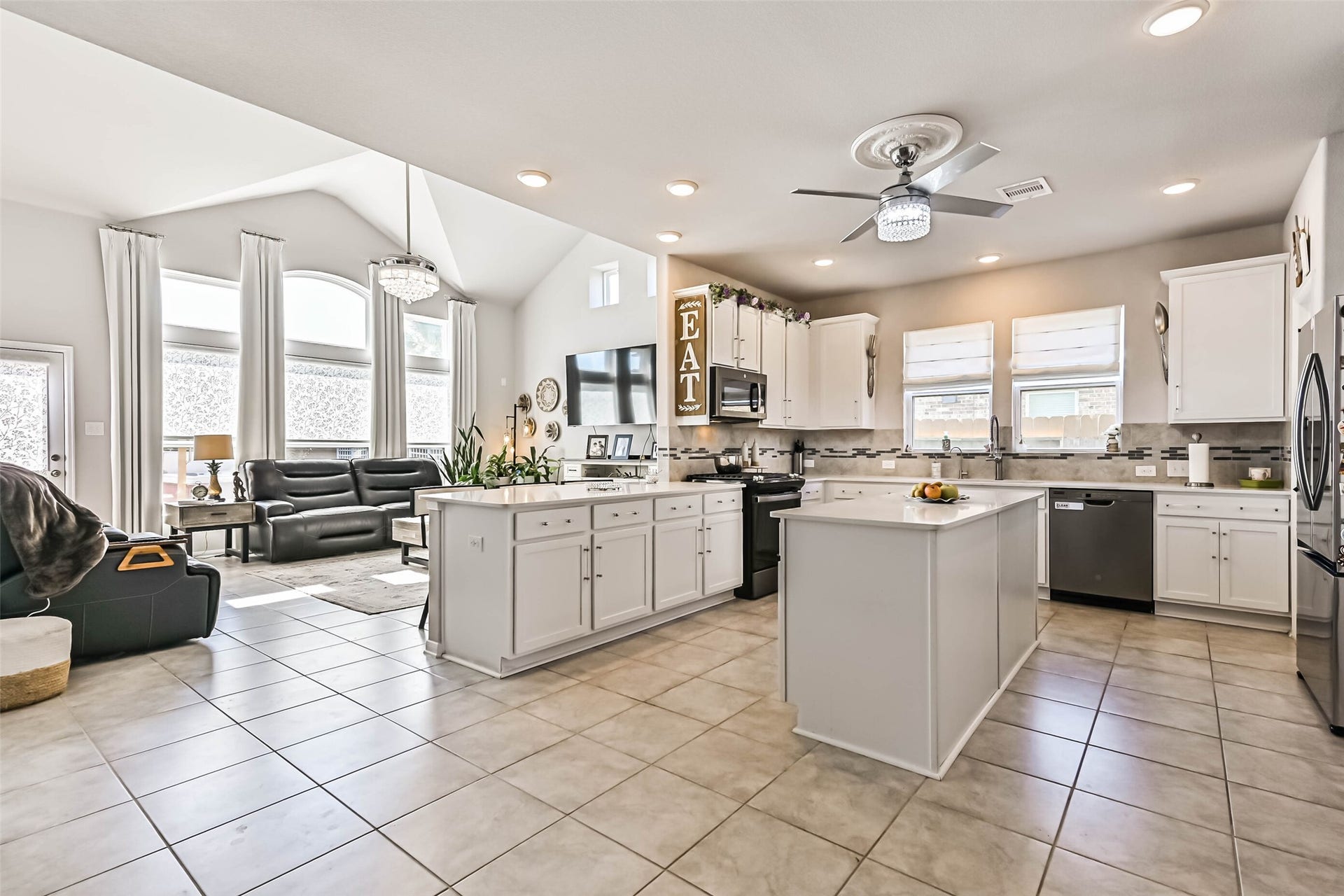 12527 Jetty Cove Drive, Texas City, TX 77568 Spacious kitchen featuring two islands, ample cabinetry, recessed lighting, and an open layout perfect for everyday living and entertaining.