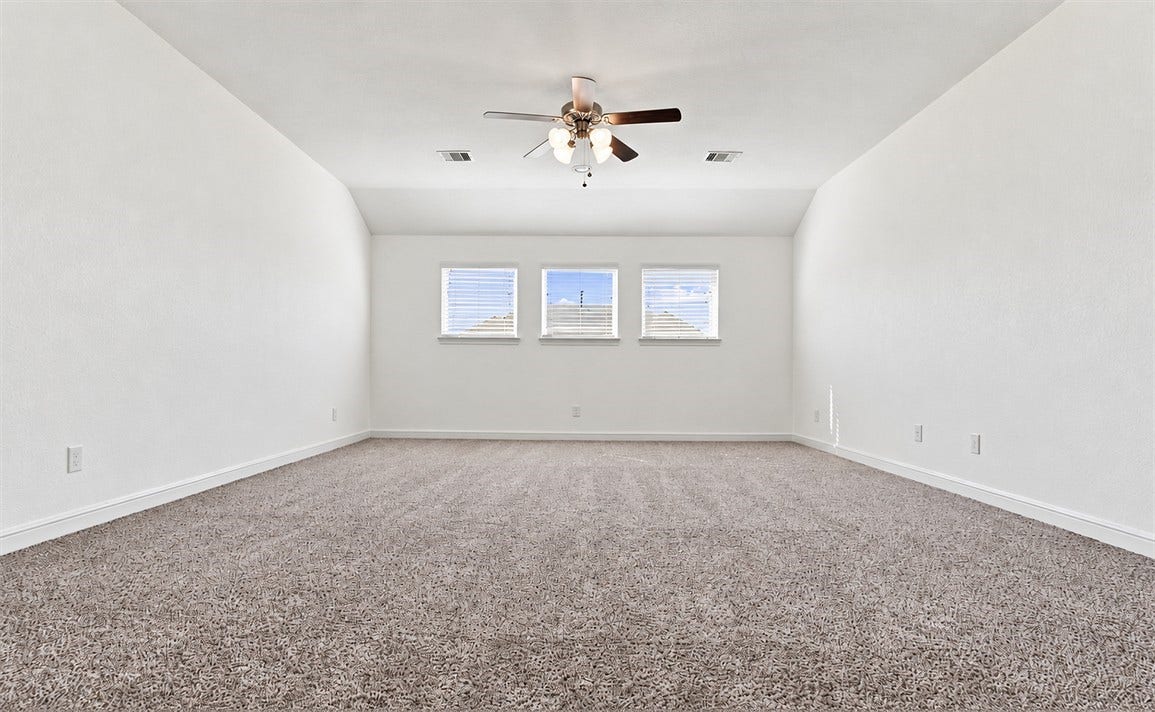 23827 Padauk Tree Trail, Katy, TX 77493 Upstairs you'll find this flexible over-sized game room with carpet flooring, ready to become whatever your family needs, a play area, hangout spot, or second living room.