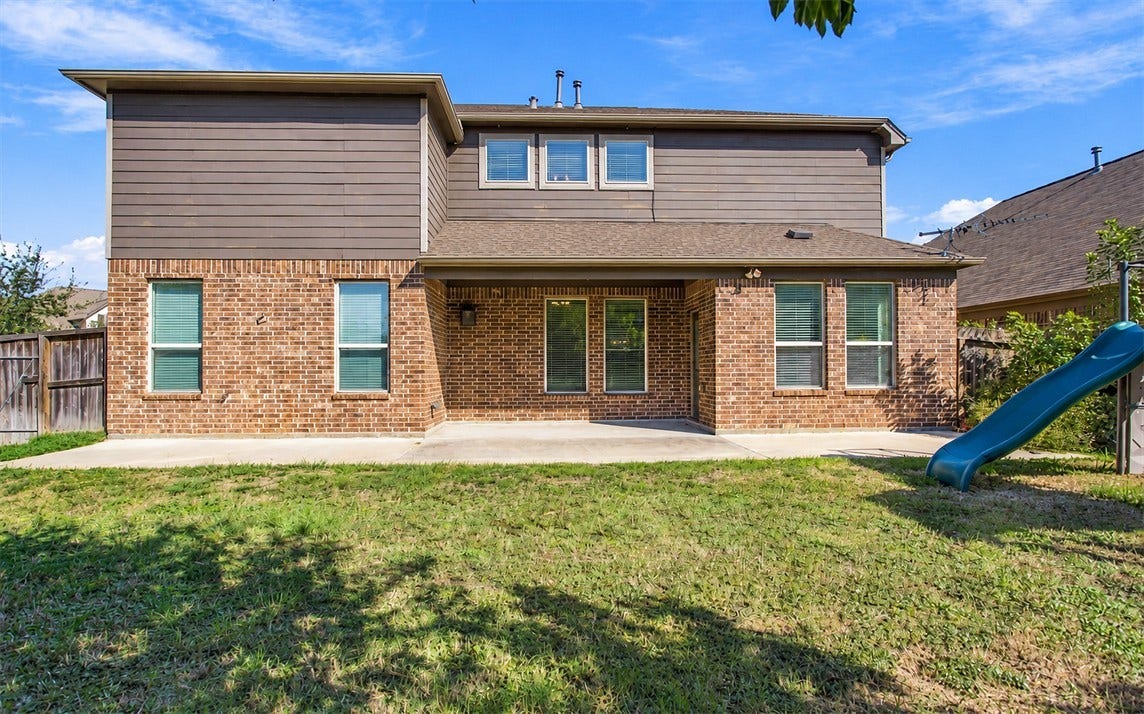 23827 Padauk Tree Trail, Katy, TX 77493 Step out back to the covered patio and spend your evenings grilling, relaxing or entertaining.