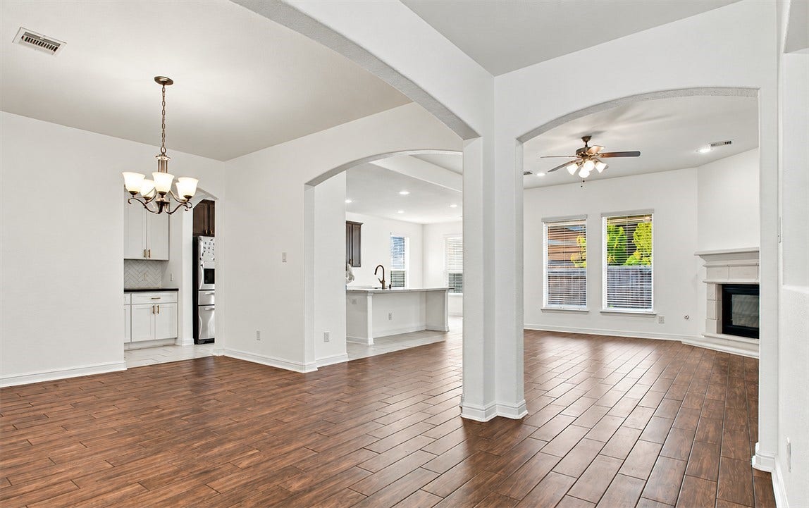 23827 Padauk Tree Trail, Katy, TX 77493 The formal living and dining area, showing just how open and connected this floor plan really is.