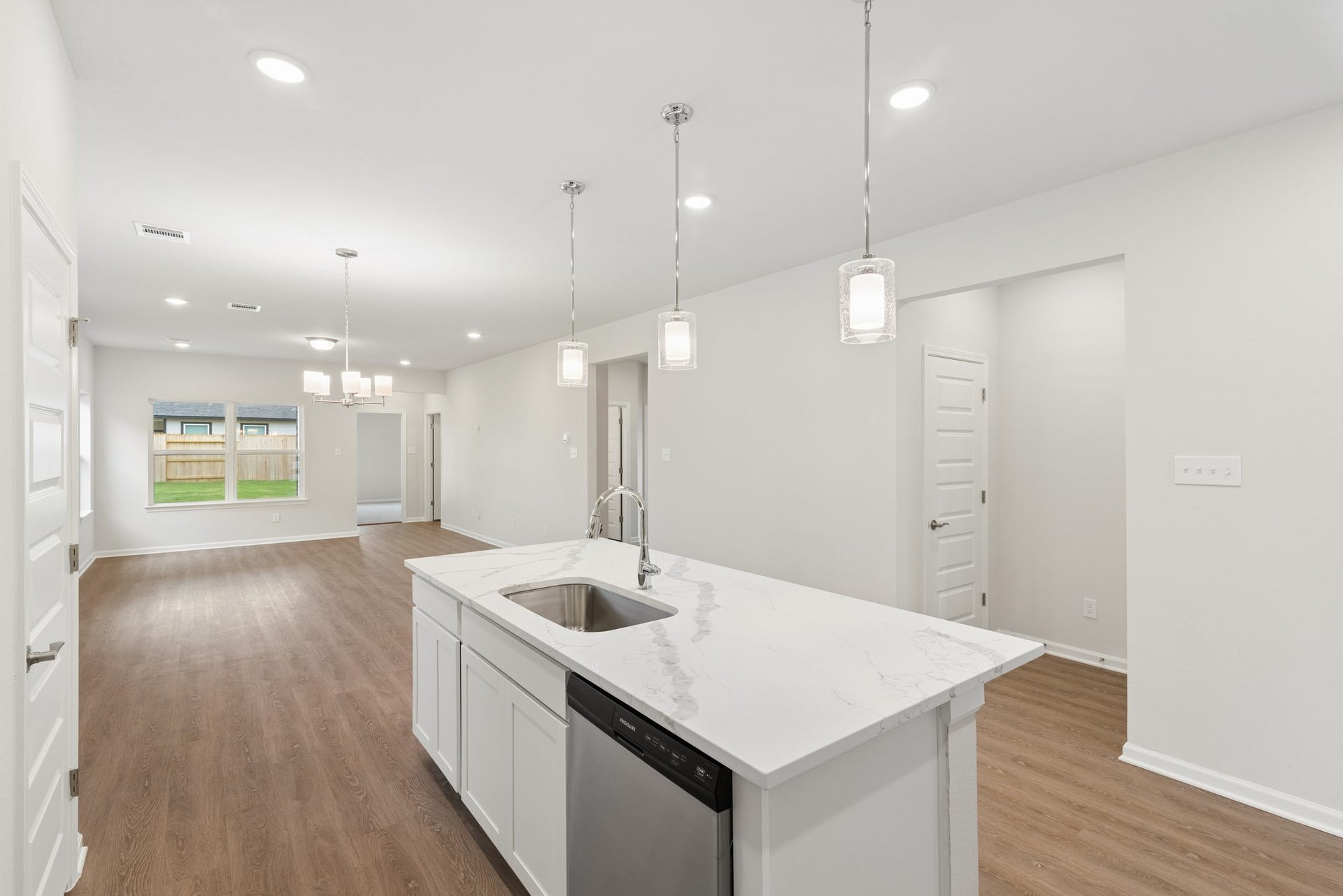 The Oakshire II- Kitchen into Dining Area.  Sample image for illustration; upgrades, options, and colors may vary.