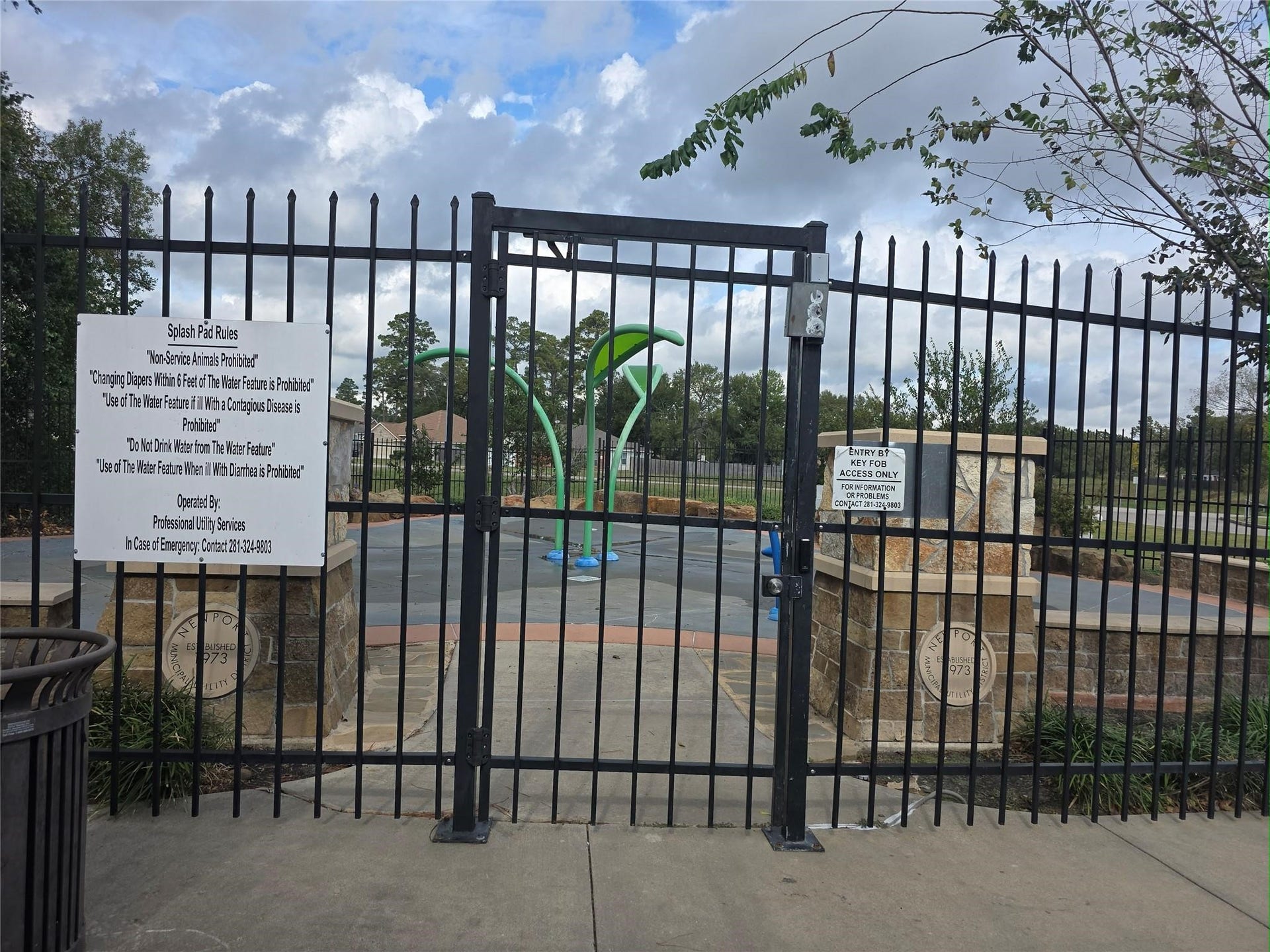 Gated community splash pad offering secure, family-friendly outdoor fun with key fob access.