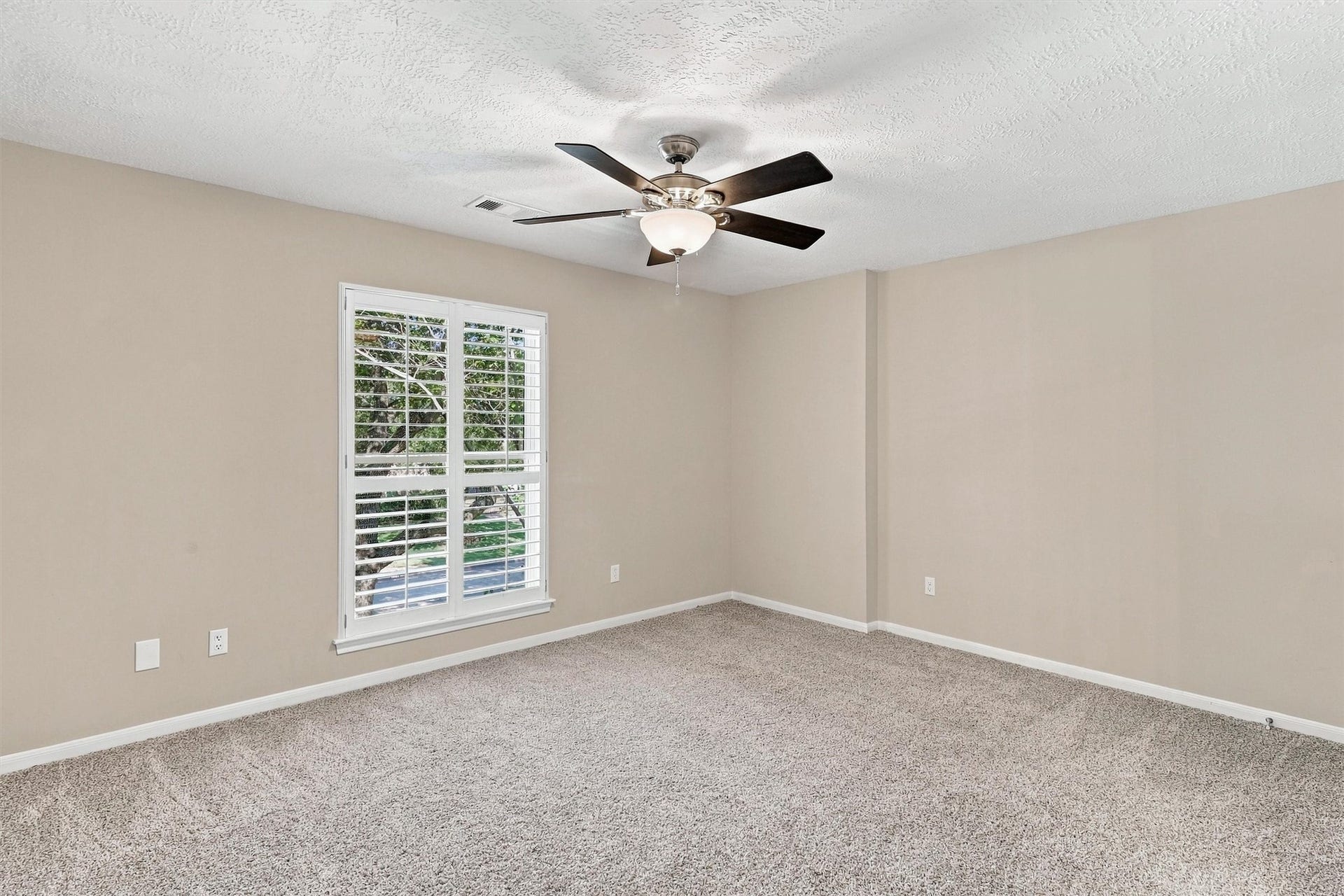 1030 Barkston Drive, Katy, TX 77450 Guest bedroom number three offers plush carpet, designer paint, and a ceiling fan, making it a blank canvas ready for you to make your own.