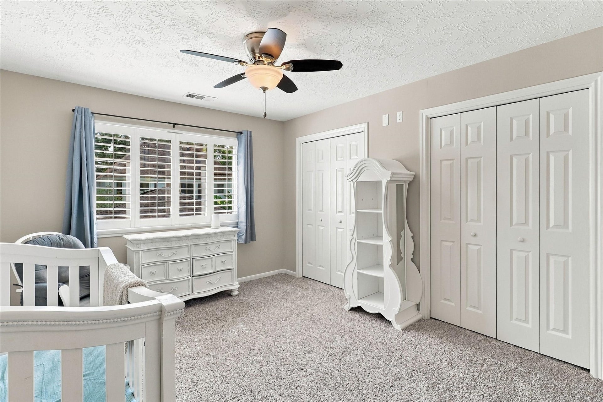 1030 Barkston Drive, Katy, TX 77450 Guest bedroom number two offers plush carpet, multiple closets, a ceiling fan, and a large window that fills the room with natural light.