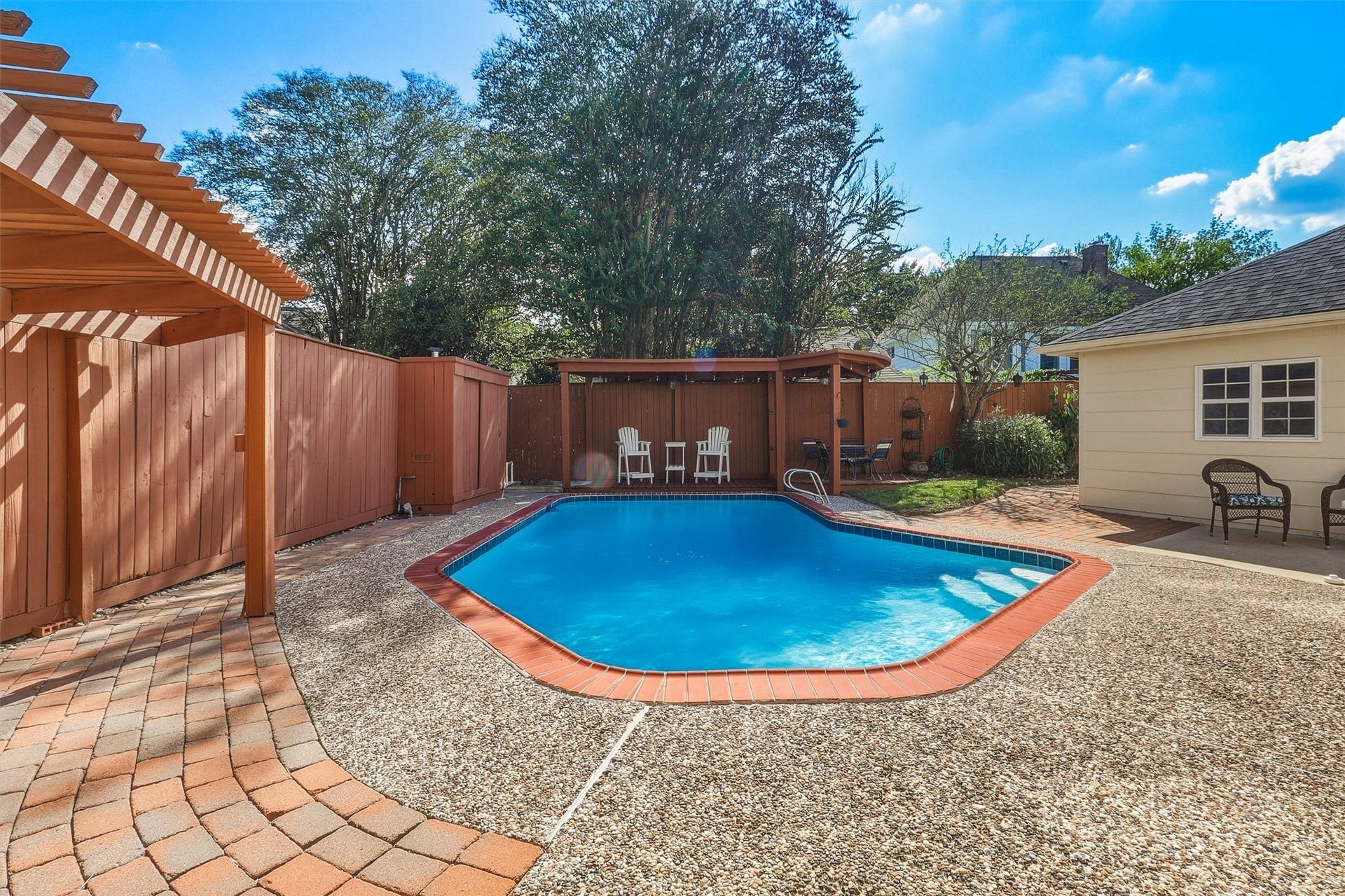 1030 Barkston Drive, Katy, TX 77450 The backyard has so much to offer, including a natural gas line ready for your grill setup, a covered deck with ceiling fans perfect for outdoor gatherings, and the sparkling heated pool as the centerpiece.