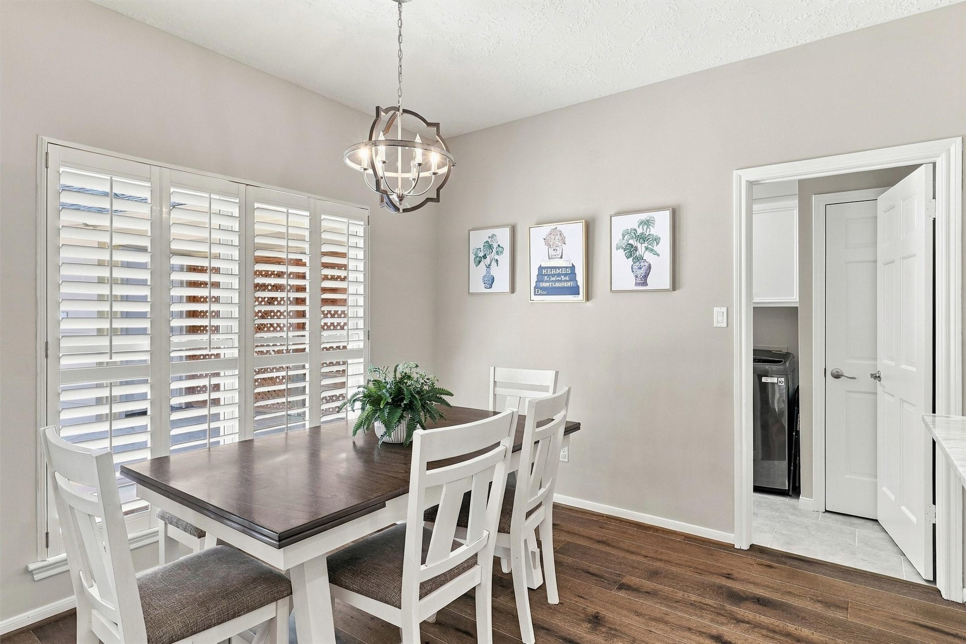 1030 Barkston Drive, Katy, TX 77450 The spacious breakfast room is located just off the kitchen and features hardwood floors, a beautiful light fixture overhead, and windows dressed with plantation shutters that let in wonderful natural light.