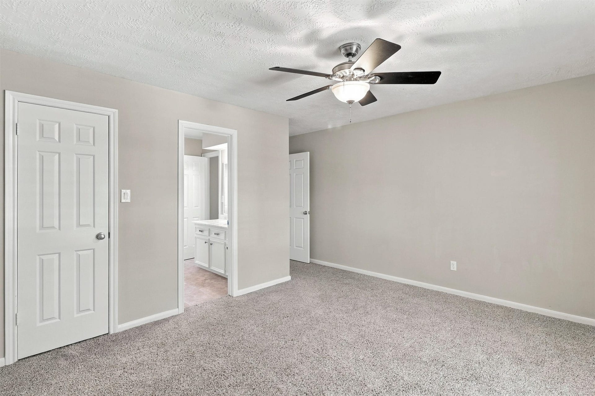 1030 Barkston Drive, Katy, TX 77450 This bedroom connects directly to an ensuite bathroom, making it perfect for guests or family staying at your home. A nicely sized closet completes the space.