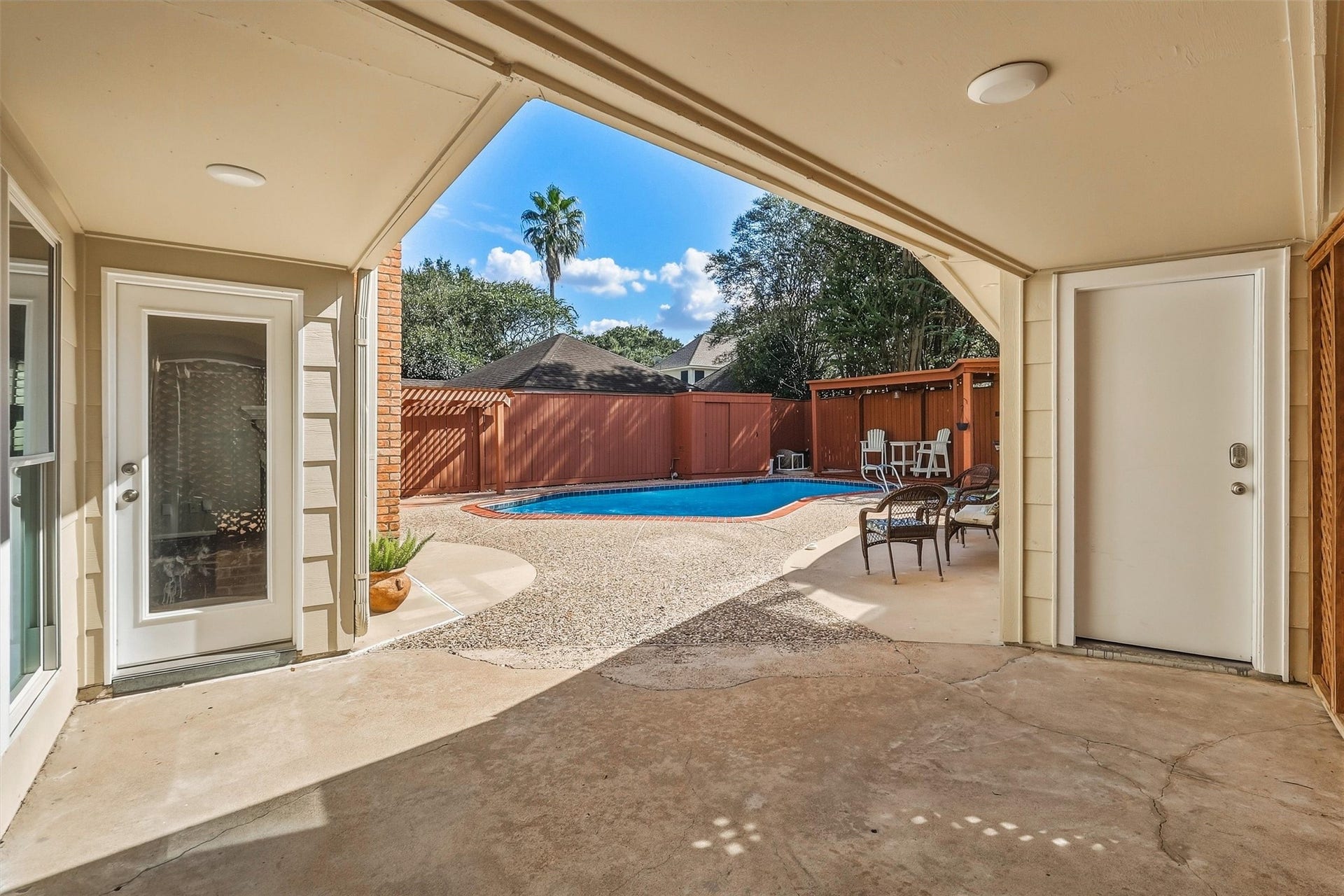 1030 Barkston Drive, Katy, TX 77450 Step outside to find the perfect place to relax and unwind, with a covered catwalk leading to the detached garage that keeps you protected from the elements.