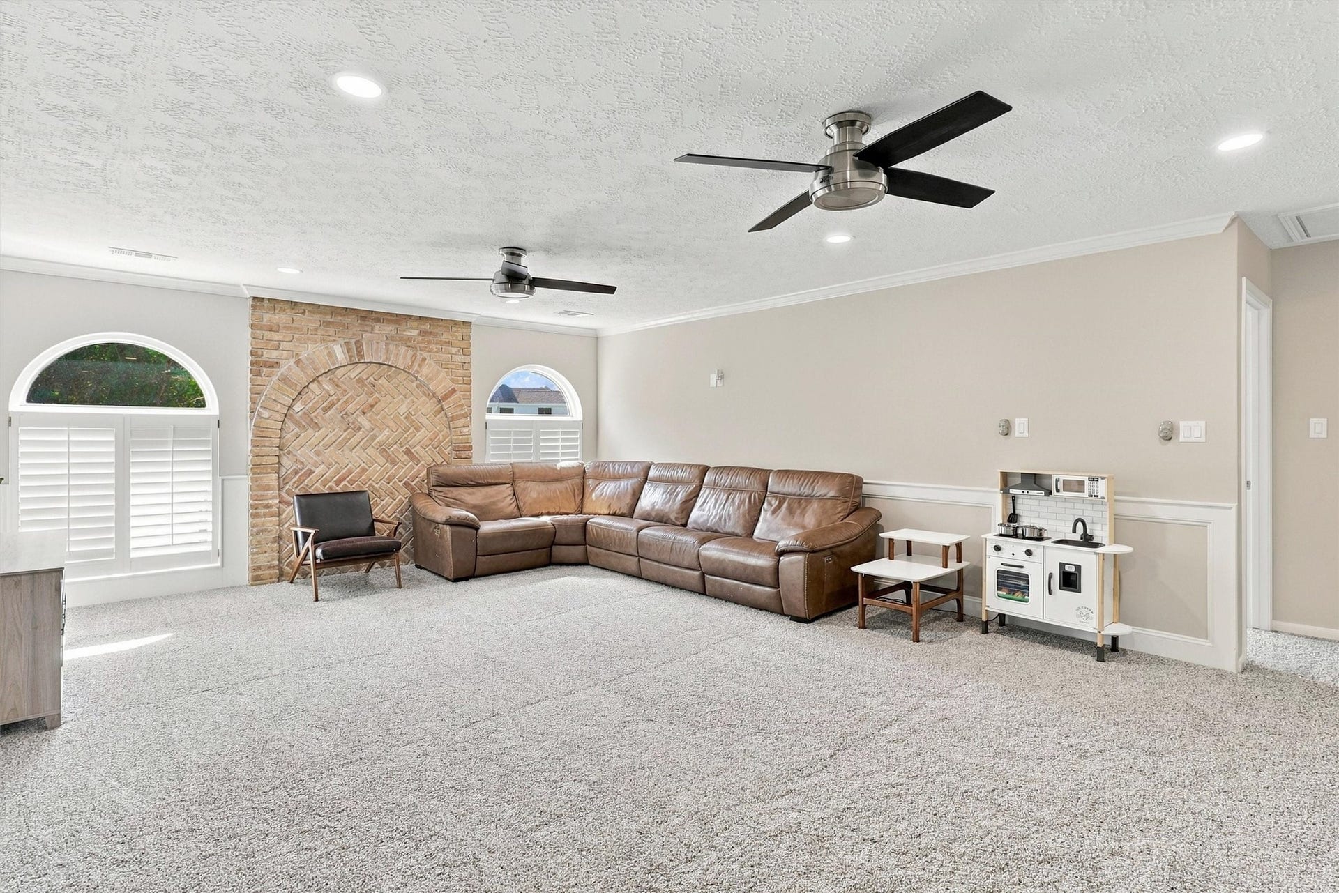 1030 Barkston Drive, Katy, TX 77450 An alternate view of the gameroom highlights just how much space is available, whether you envision a pool table and arcade games, a lively playroom, or a media room complete with a sectional and full entertainment setup.