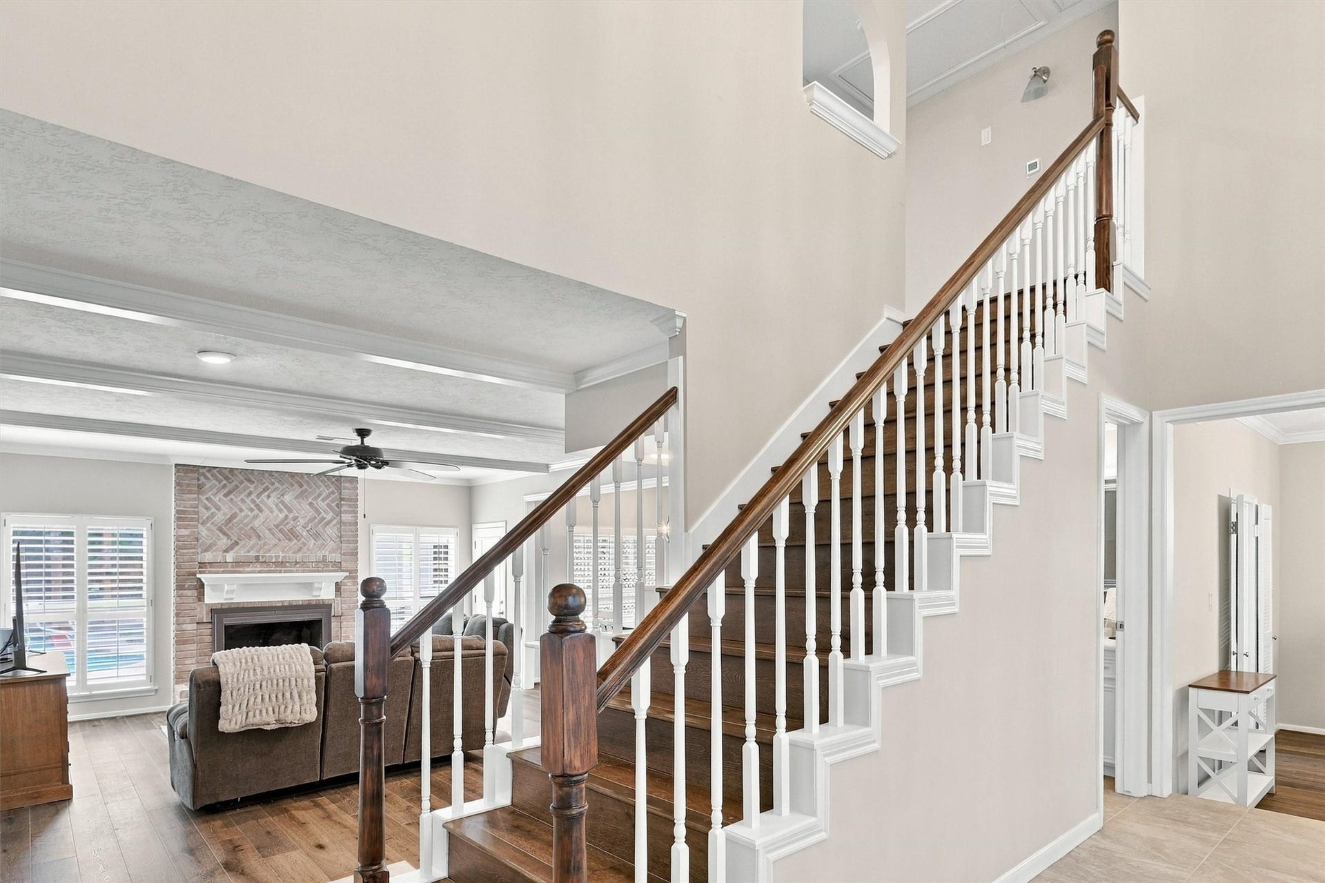 1030 Barkston Drive, Katy, TX 77450 This view from the front entryway highlights the flow of the dining room and living room, along with the beautiful wood staircase leading up to the second level.