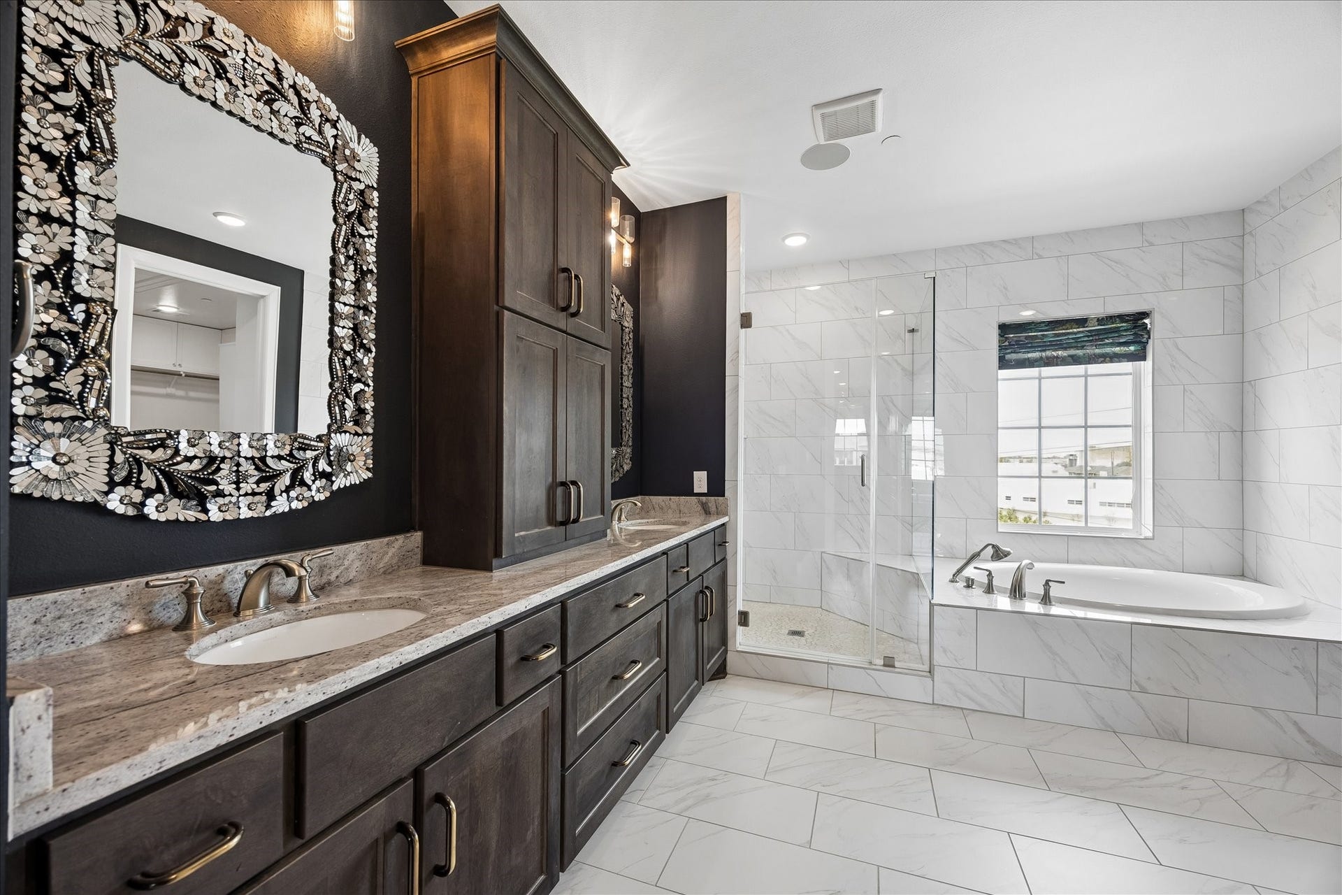 3606 Somerset York Lane, Houston, TX 77055 Inspired by luxury spas, the primary bath features sophisticated finishes, dual vanities, and exceptional attention to detail.