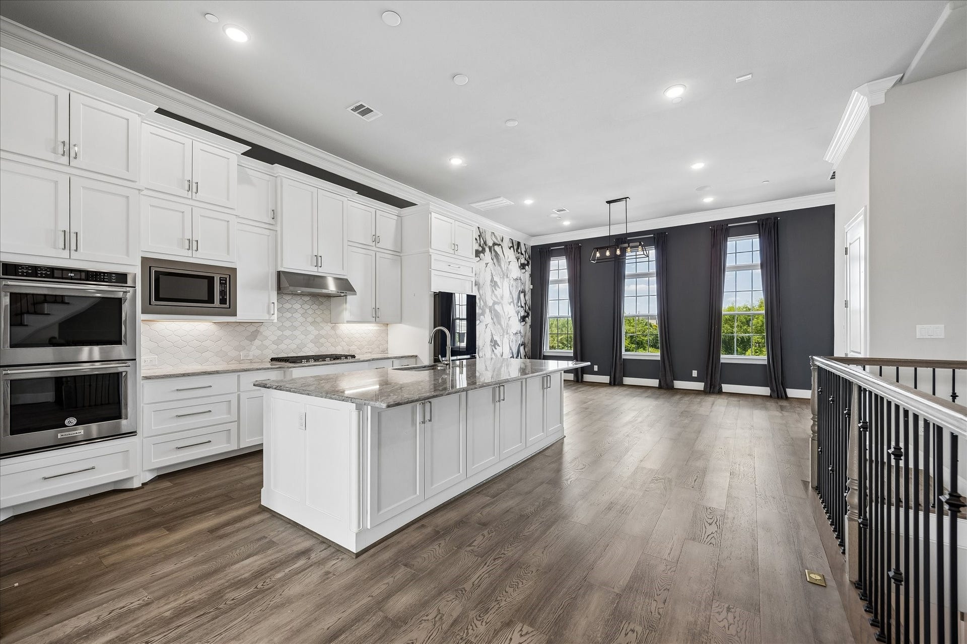 3606 Somerset York Lane, Houston, TX 77055 A spacious island anchors the kitchen, providing the ideal space for cooking, casual dining, and entertaining guests.