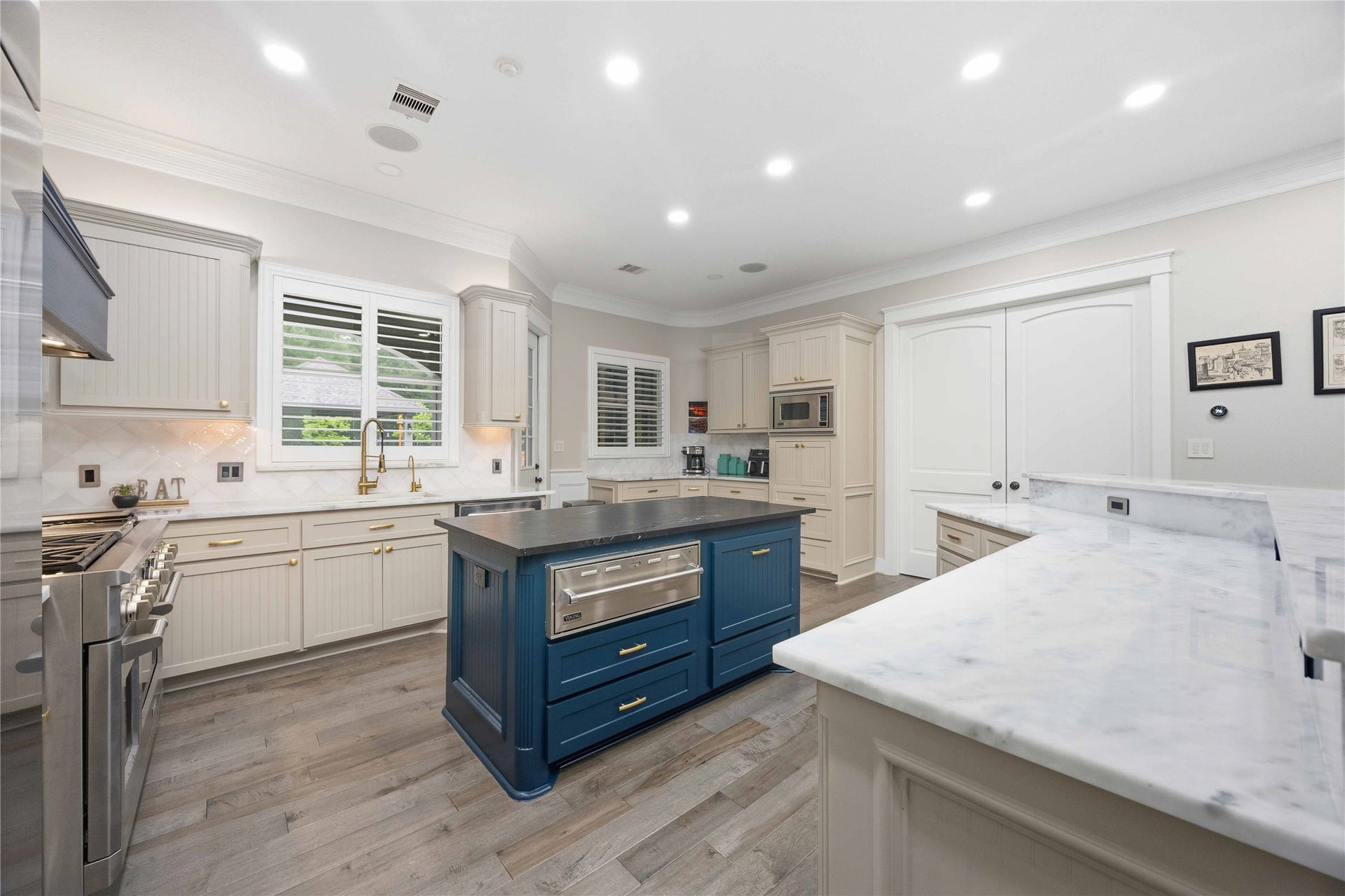 Gorgeous kitchen overlooks the backyard oasis