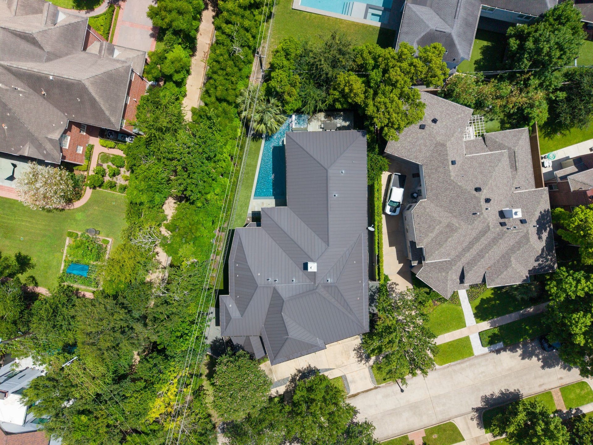 3703 Wroxton Road, West University Place, TX 77005 Situated on an exclusive cul-de-sac in the heart of West University, this aerial view captures the home's generous footprint, private pool, mature landscaping, and premier location in the sought-after 3700 block.