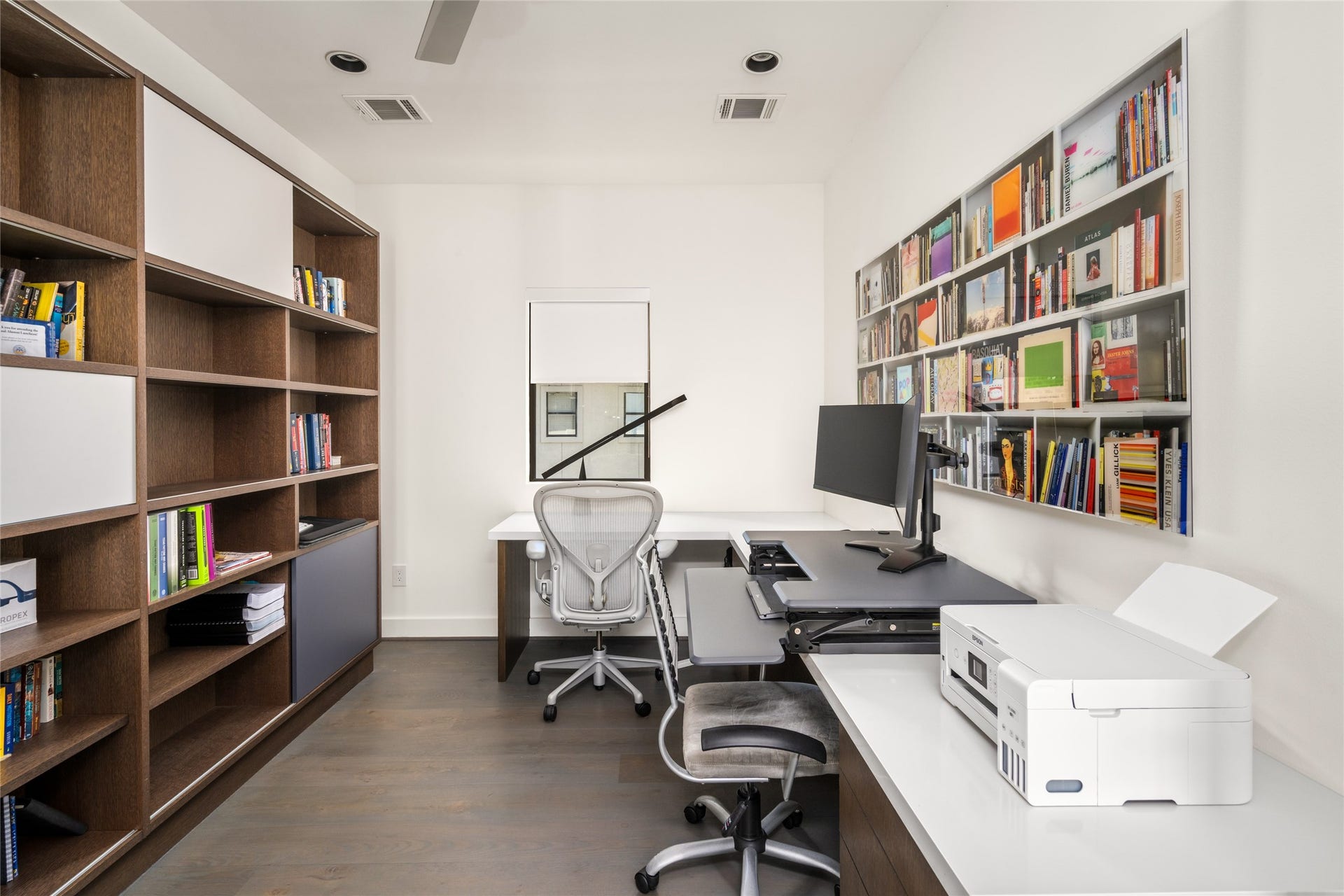 3703 Wroxton Road, West University Place, TX 77005 Flexible upstairs office with custom built-ins and generous workspace, ideal for working from home, a creative studio, craft room, or homework center.