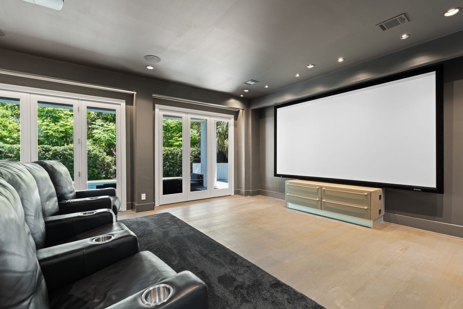 3703 Wroxton Road, West University Place, TX 77005 Enjoy a true cinematic experience in the dedicated theater room, complete with a large projection screen, surround sound, and direct access to the poolperfect for movie nights, game days, and entertaining.