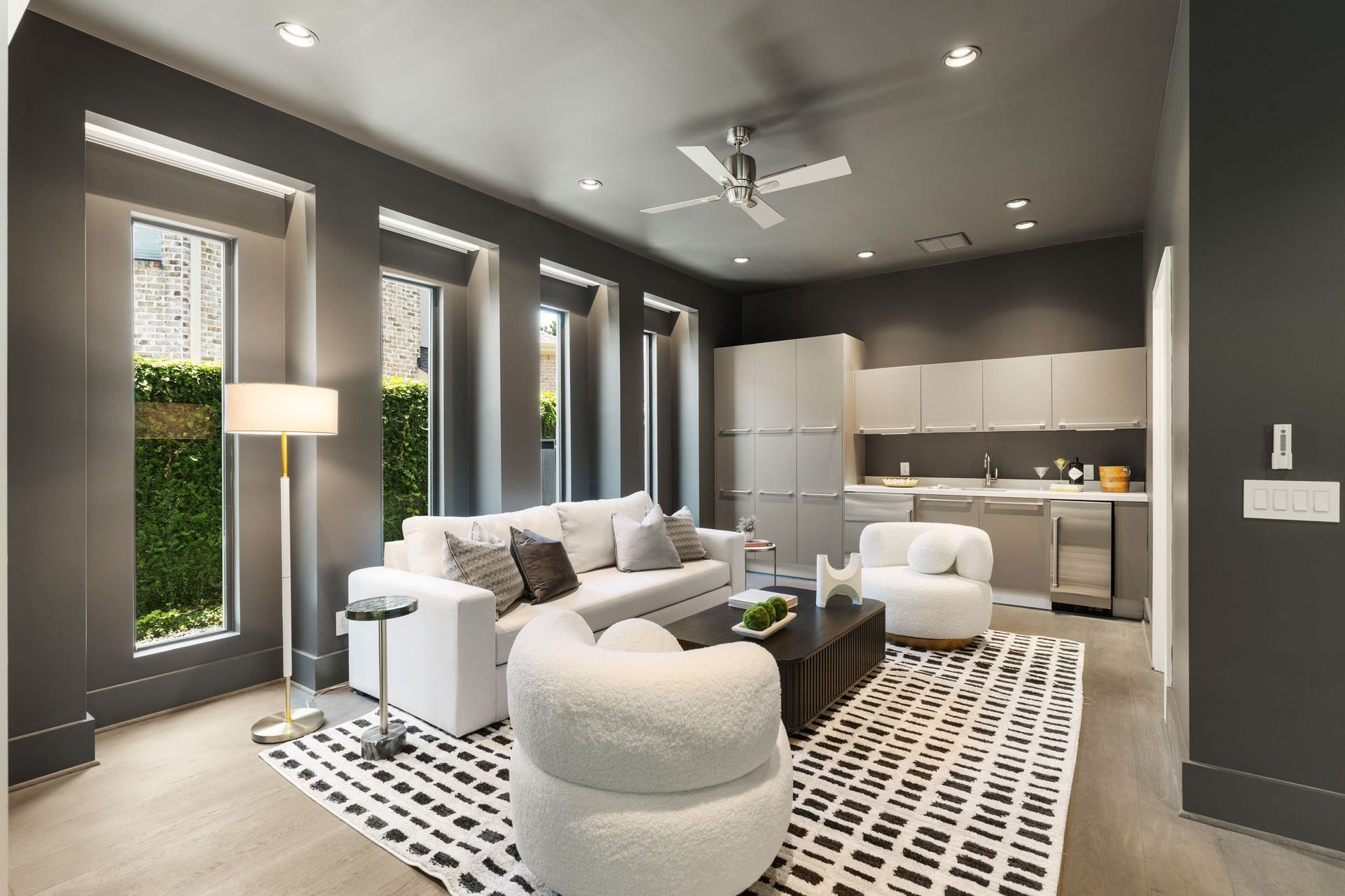 3703 Wroxton Road, West University Place, TX 77005 Designed for entertaining, the expansive game room features a stylish wet bar with custom cabinetry, beverage refrigerator, and flexible space for gaming, media, or casual gatherings.