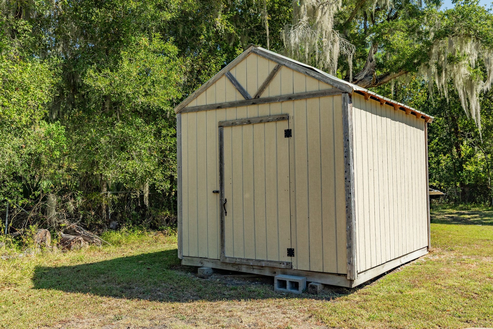 1602 County Road 939, Sweeny, TX 77480 Convenient freestanding storage shed features neutral siding, wood trim, and a single entry door. A practical addition for storing lawn equipment, tools, and outdoor essentials.