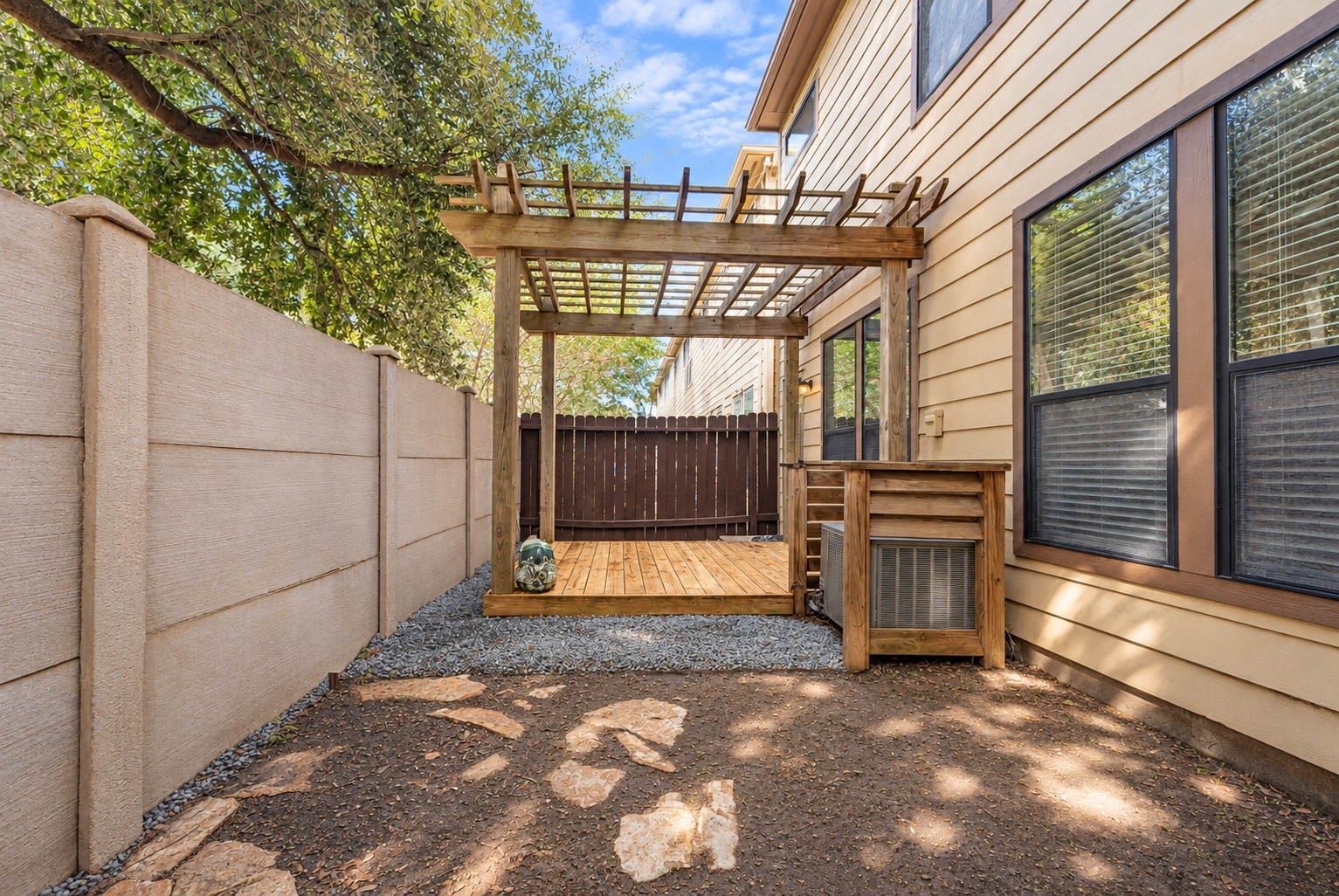 1316 Studer Street, Houston, TX 77007 The fenced outdoor area offers a wonderful combination of privacy and low-maintenance outdoor living.