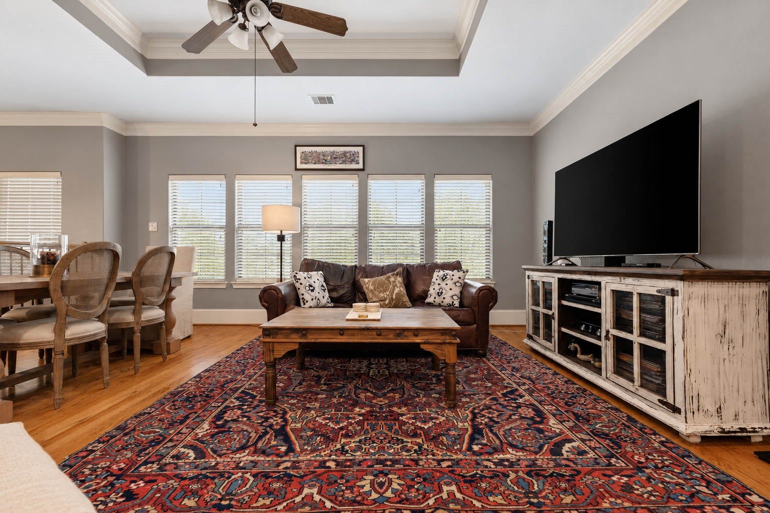 1316 Studer Street, Houston, TX 77007 Another perspective of the family room highlights the impressive scale of this gathering space and its effortless connection to the adjoining dining area.