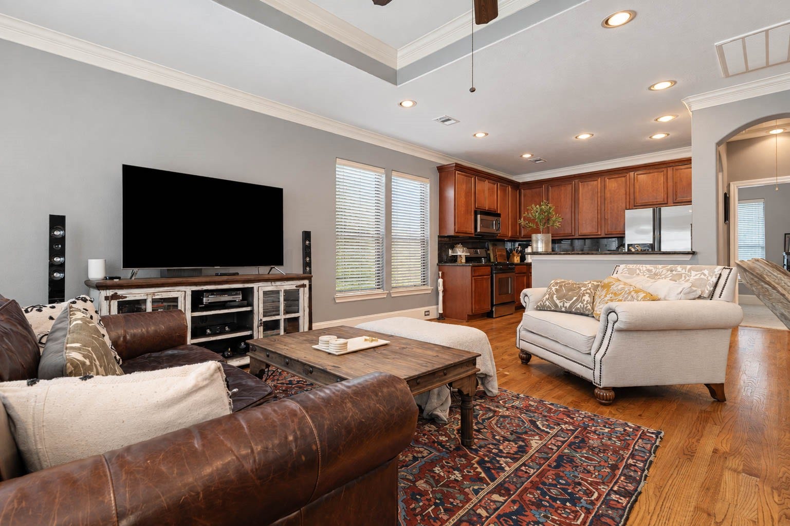 1316 Studer Street, Houston, TX 77007 From the dining area, the open-concept design unfolds into the spacious family room and kitchen beyond.