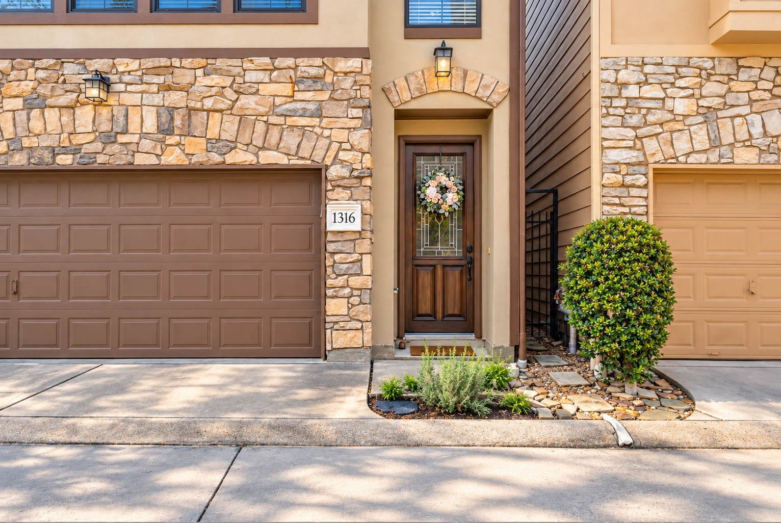 1316 Studer Street, Houston, TX 77007 A closer look at the homes distinctive exterior highlights its timeless stone and stucco faade, 2-car attached garage, and welcoming entry.