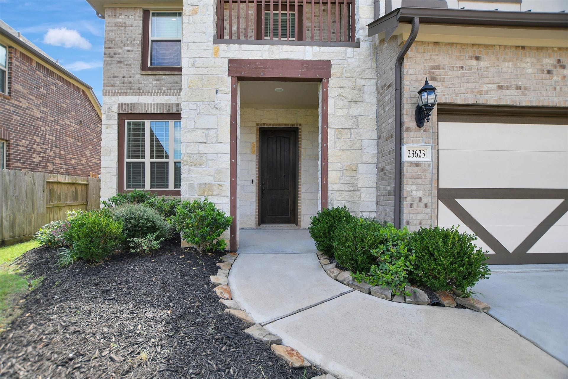 23623 San Ricci Court, Richmond, TX 77406 Covered entrance with front balcony.