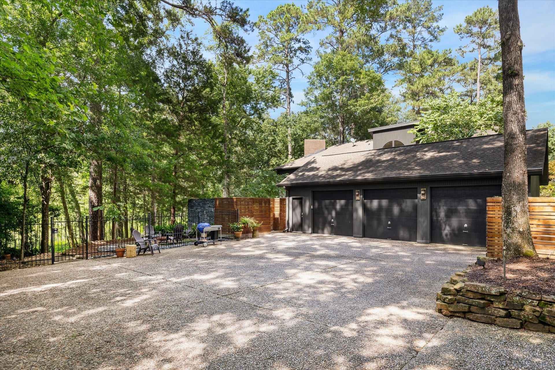 23414 Holly Hollow Street, Tomball, TX 77377 Oversized three-car garage with ample room for vehicles, storage, and workshop or hobby use.