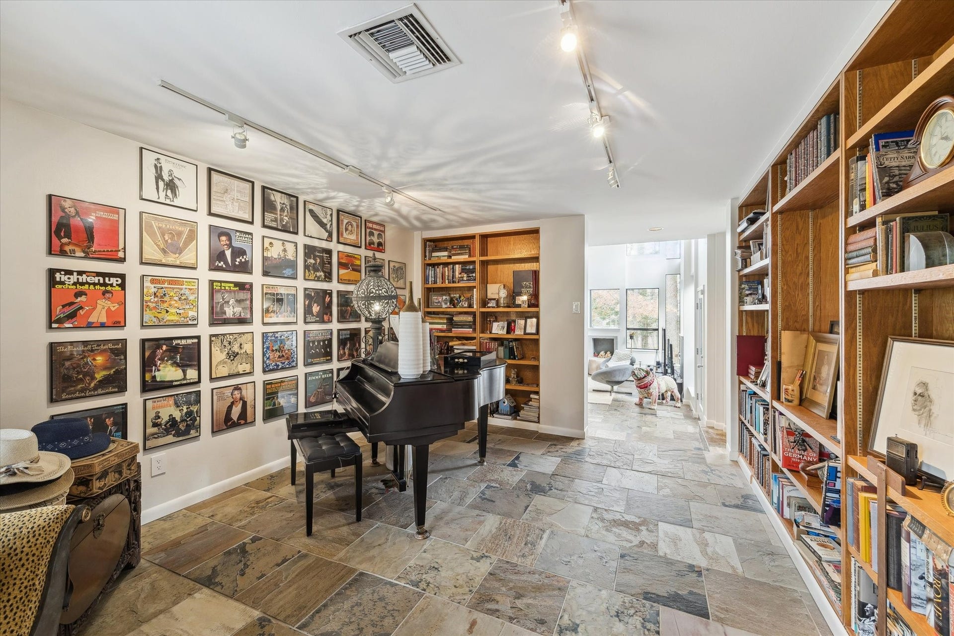 23414 Holly Hollow Street, Tomball, TX 77377 Versatile room currently used as a music room, featuring floor-to-ceiling built-in bookshelves also lends itself well to use as a private study/home office, or a library.