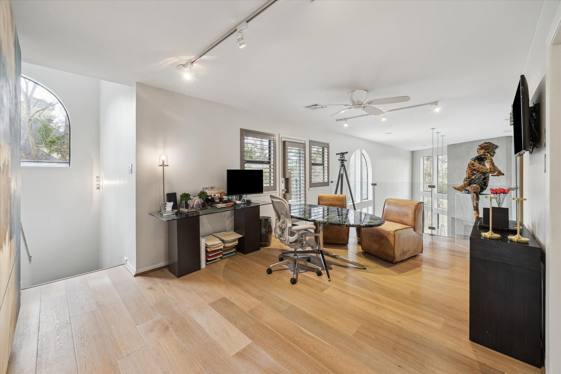 23414 Holly Hollow Street, Tomball, TX 77377 Versatile loft space with views of the main living areas, perfect for a home office, media room, or quiet retreat, seamlessly blending openness and privacy. This area can easily be converted back into a fourth bedroom.