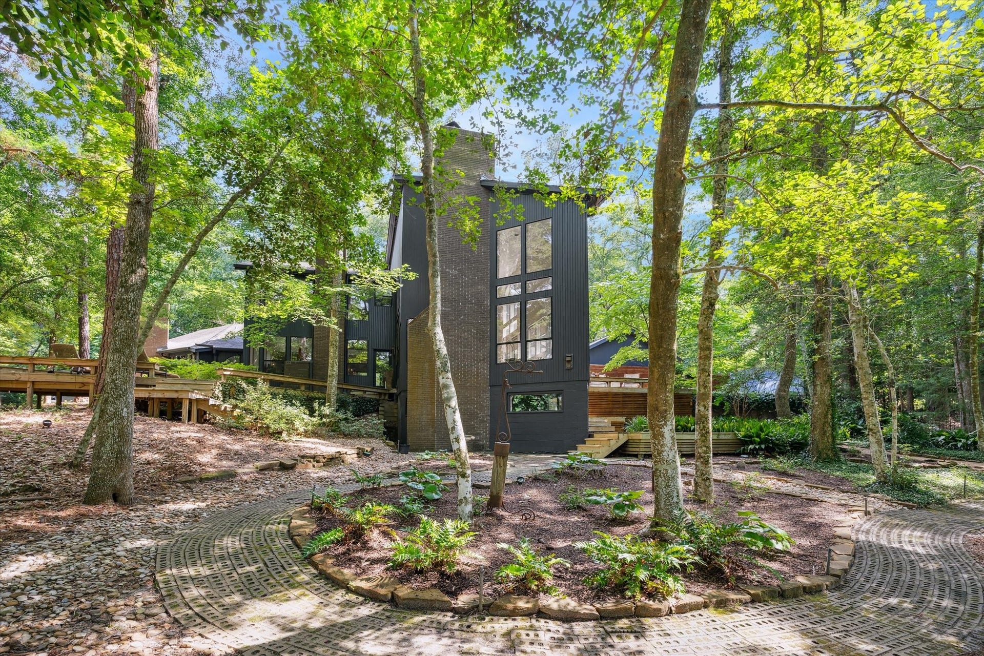 23414 Holly Hollow Street, Tomball, TX 77377 An effortless blend of architecture and nature, creating a sense of calm at every turn.