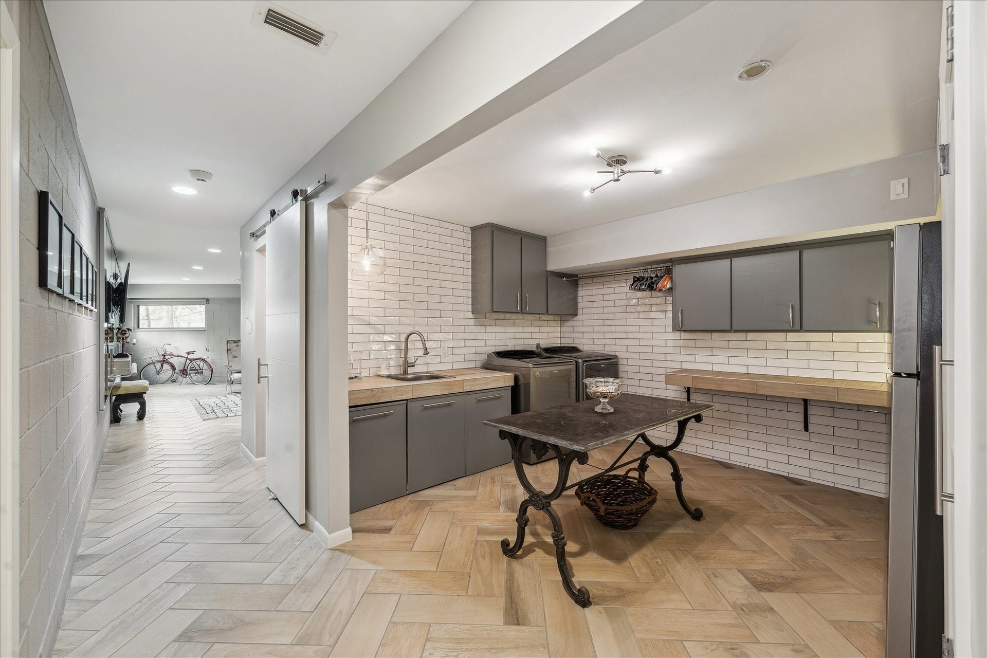 23414 Holly Hollow Street, Tomball, TX 77377 The large utility room adds practical function with its sink, counter space and abundant storage. There is space for a full-size refrigerator.