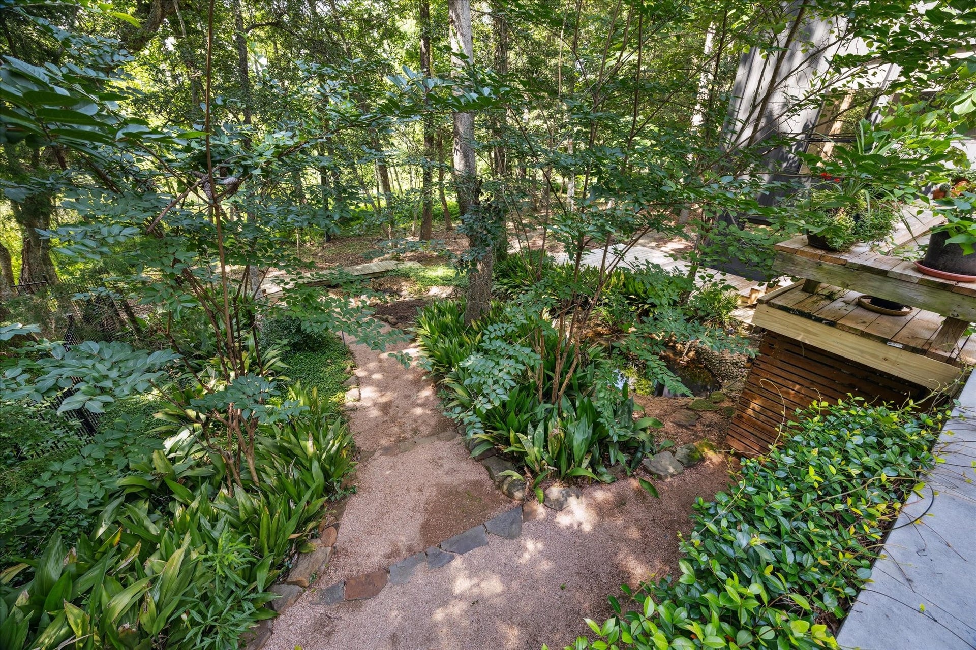 23414 Holly Hollow Street, Tomball, TX 77377 Outdoors, your personal paradise unfolds with multiple patios, terraced seating areas, and balconies that overlook the sylvan splendor surrounding the dwelling.
