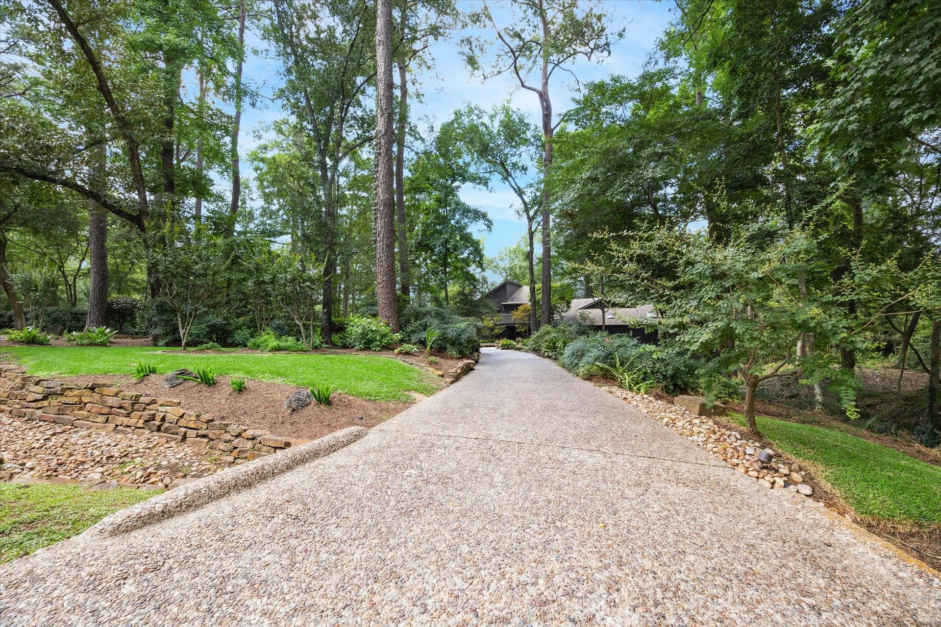 23414 Holly Hollow Street, Tomball, TX 77377 A natural corridor of trees and foliage leading you home each day.