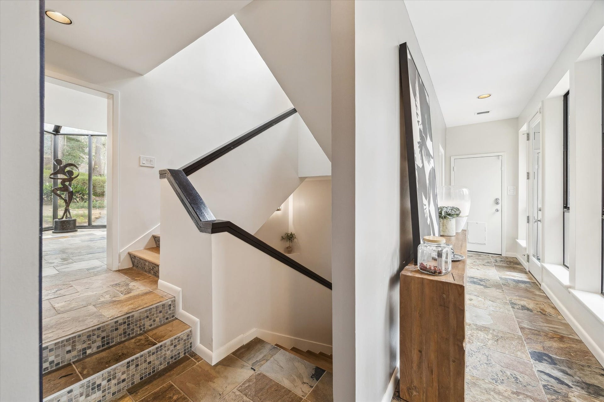 23414 Holly Hollow Street, Tomball, TX 77377 Stairs designed as a visual experience, surrounded by light and natural textures.