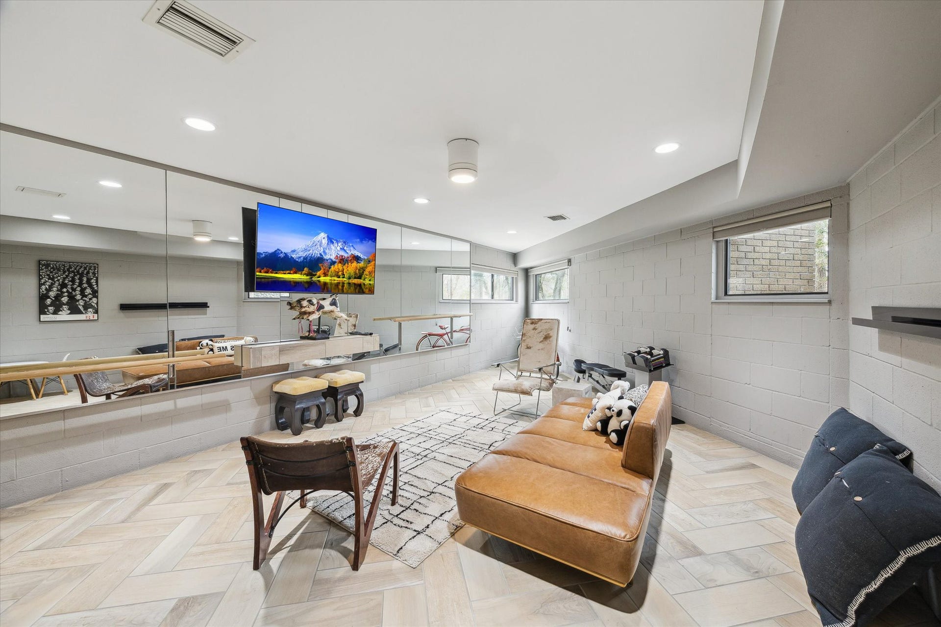 23414 Holly Hollow Street, Tomball, TX 77377 The lower level is ready to adapt, whether you're building a creative studio, game room, gym or quiet workspace for hobbies or productivity.