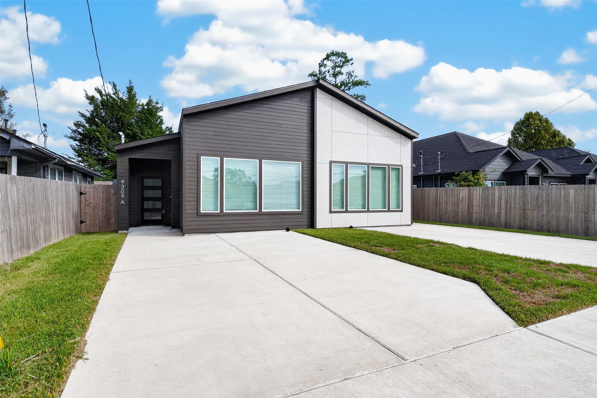 9309 Caddo Road, #A, Houston, TX 77078 From the moment you pull up, the striking facade and long, spacious driveway make a bold impression, offering plenty of parking for family and guests.