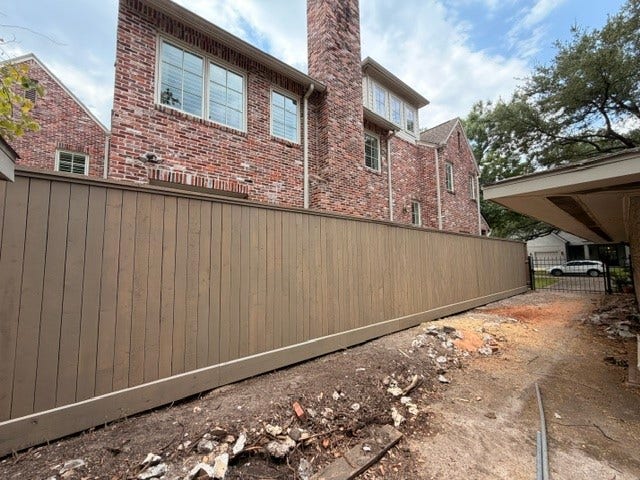 4019 Sul Ross Street, Houston, TX 77027 A view down the driveway of the existing property with the custom home that Rallin Welch built almost 20 years ago.