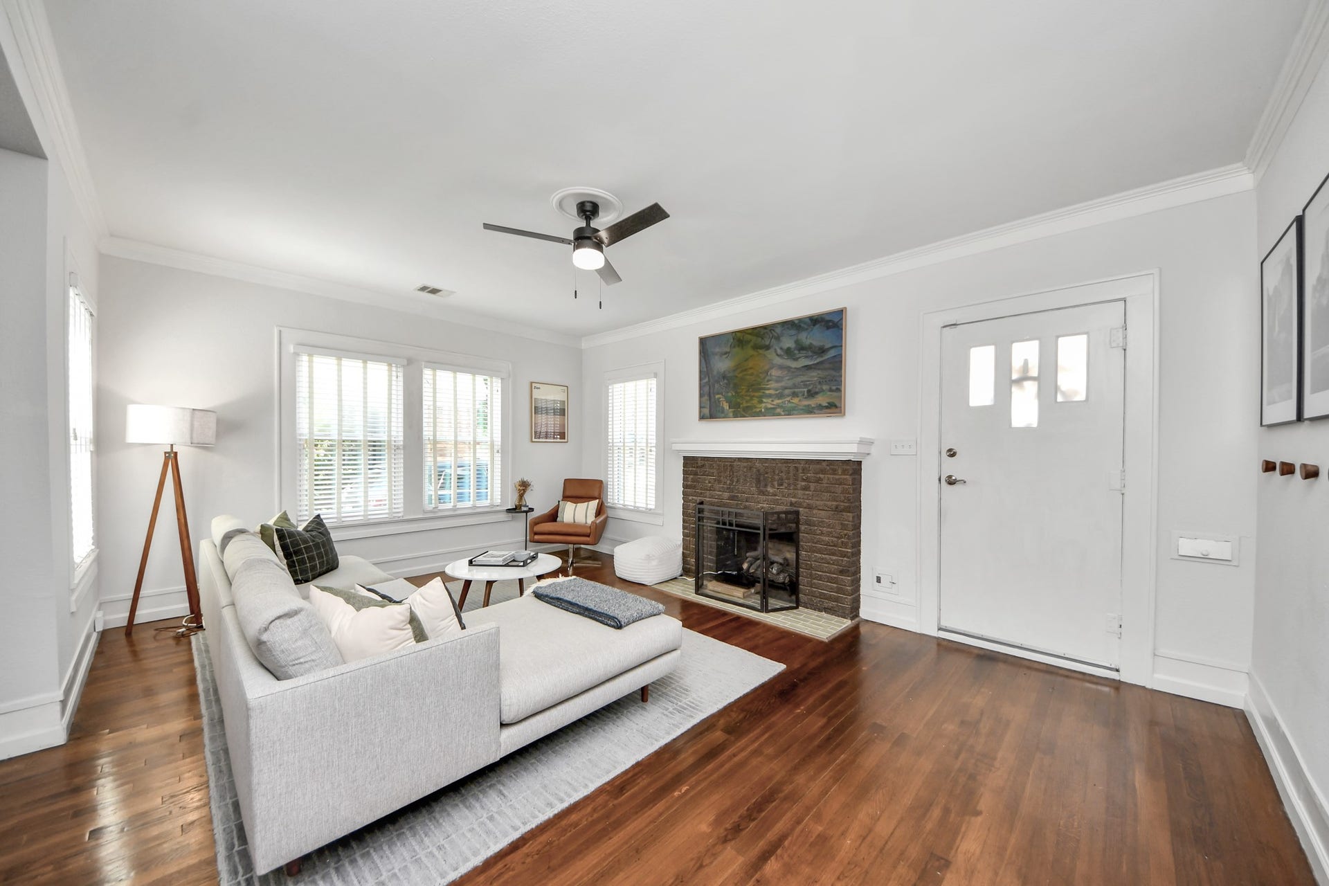 A welcoming living space where historic charm meets everyday comfort, offering a versatile setting for relaxing or entertaining.