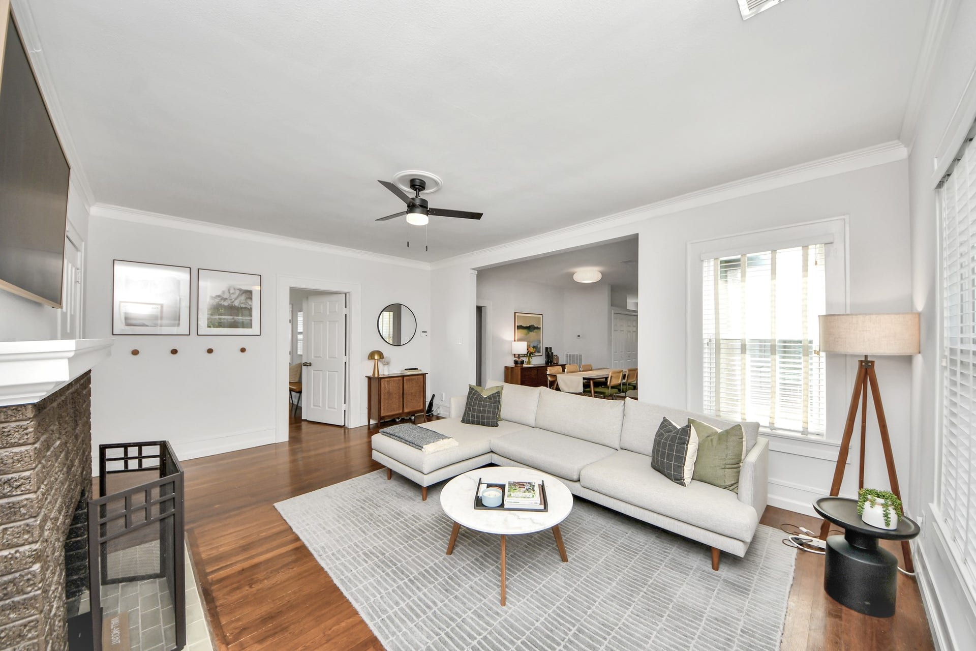 Hardwood flooring adds warmth and architectural character, creating a living area that feels both classic and comfortable.