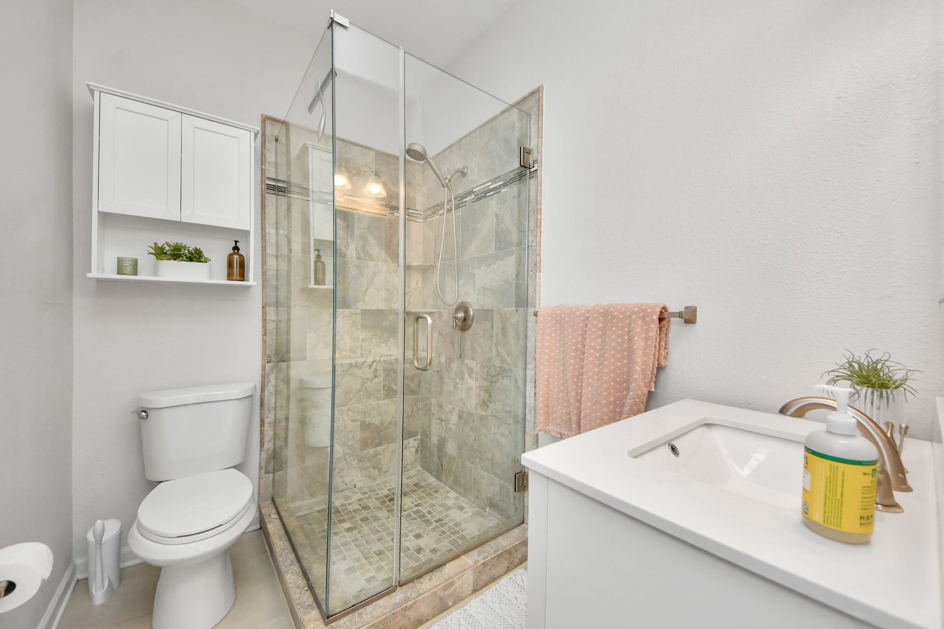 The primary bathroom offers a comfortable and functional space designed to complement everyday living with ease and convenience.