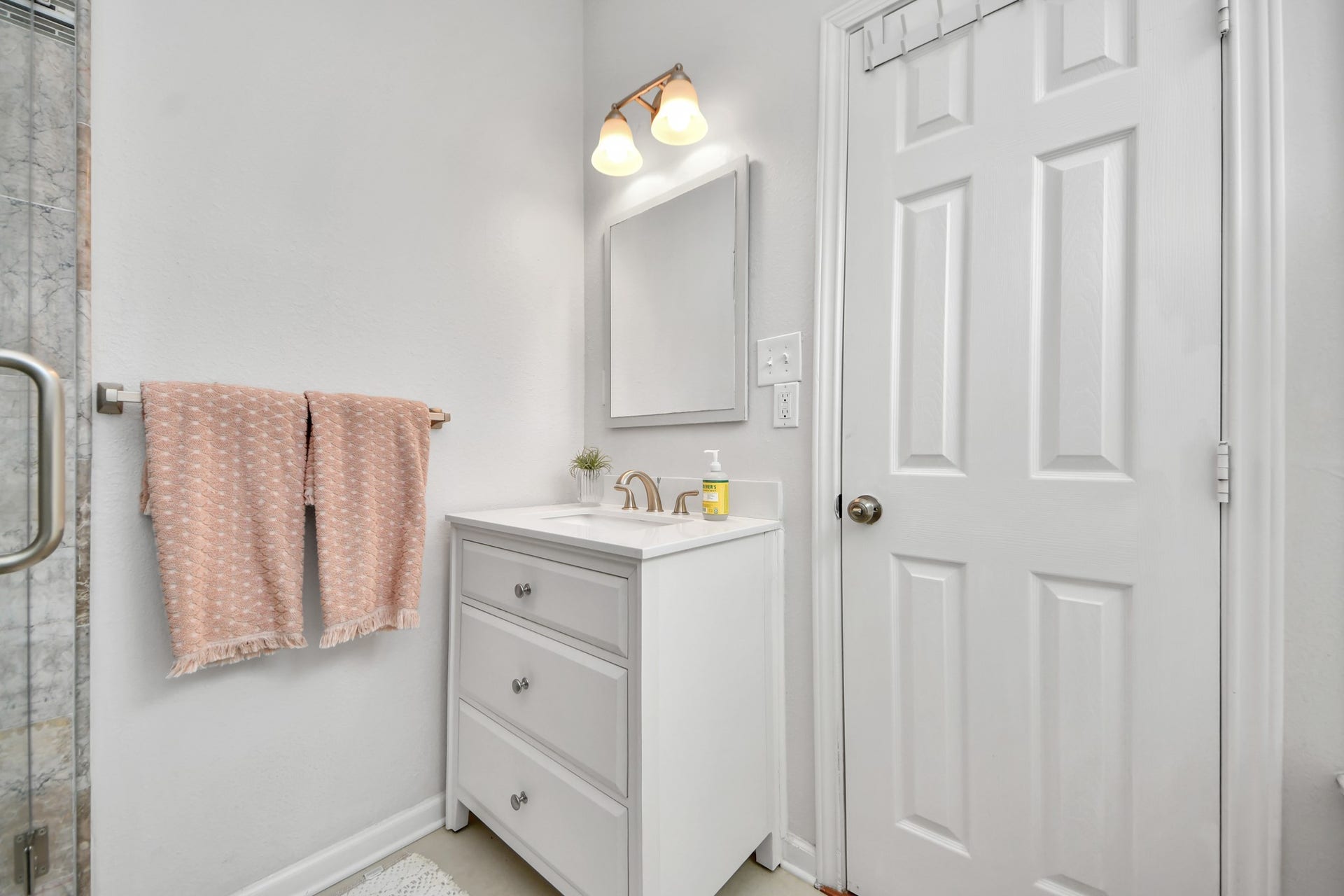 A private retreat within the primary suite, this bathroom provides a practical and inviting space to begin and end each day.