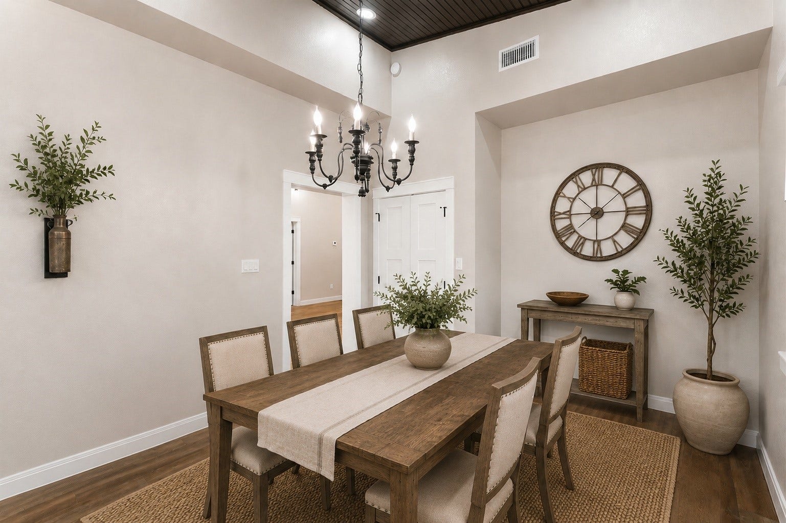 4864 County Road 182 Off, Alvin, TX 77511 This room can be used as dining or a bonus room with the elegant tile flooring and soft taupe walls, accented by a classic chandelier. The space is finished with white trim and double doors, creating a welcoming entryway.