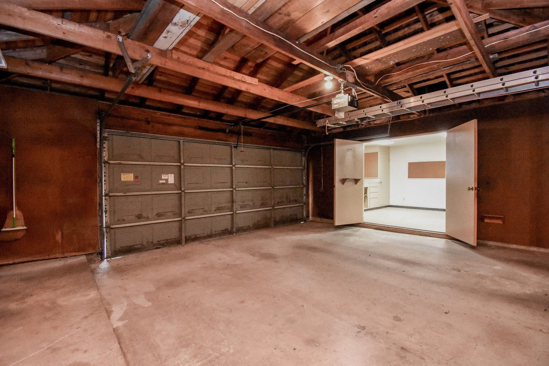 3303 Hilton Head Court, Missouri City, TX 77459 View of the interior of the garage with doors opening to the workshop.