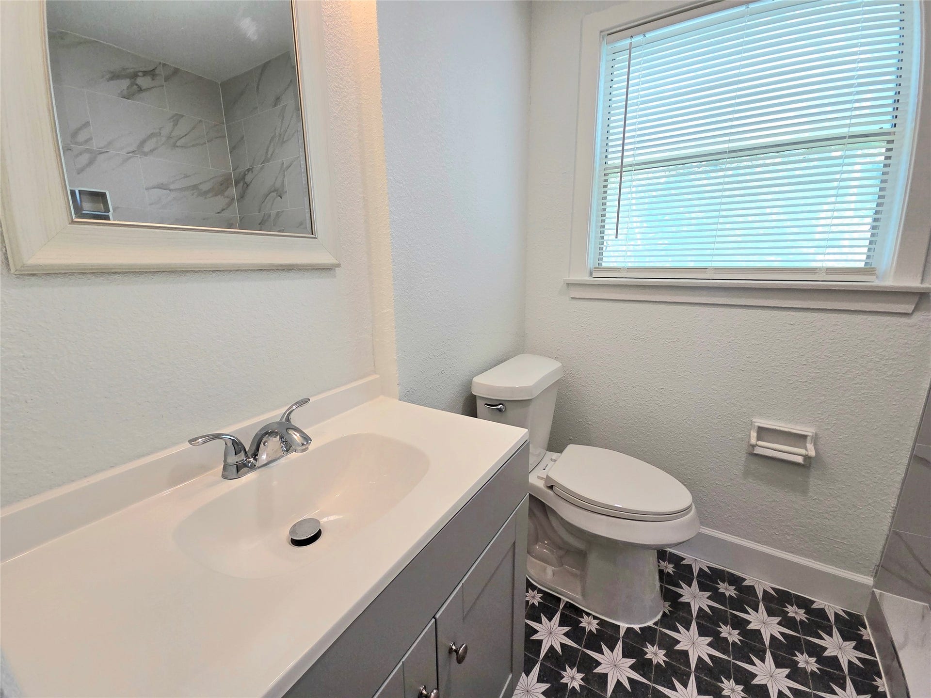 8610 Greiner Drive, Houston, TX 77080 New vanity, mirror and light fixture